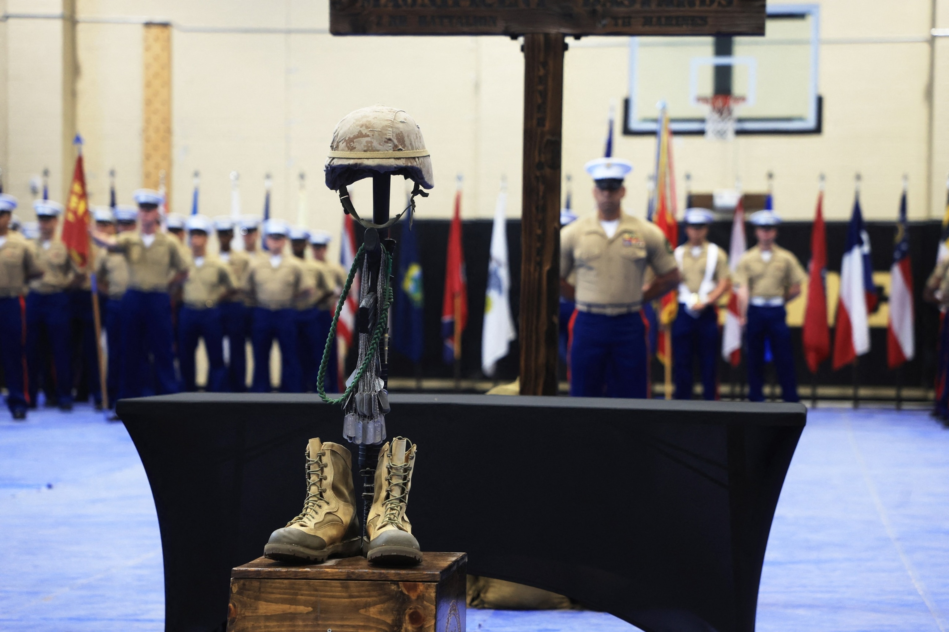 PHOTO: Military identification tags hang as veterans and gold star families of the 2nd Battalion, 4th Marines gather during a ceremony marking the 20th anniversary of the Battle of Ramadi at Camp Pendleton, California, April 5, 2024. 