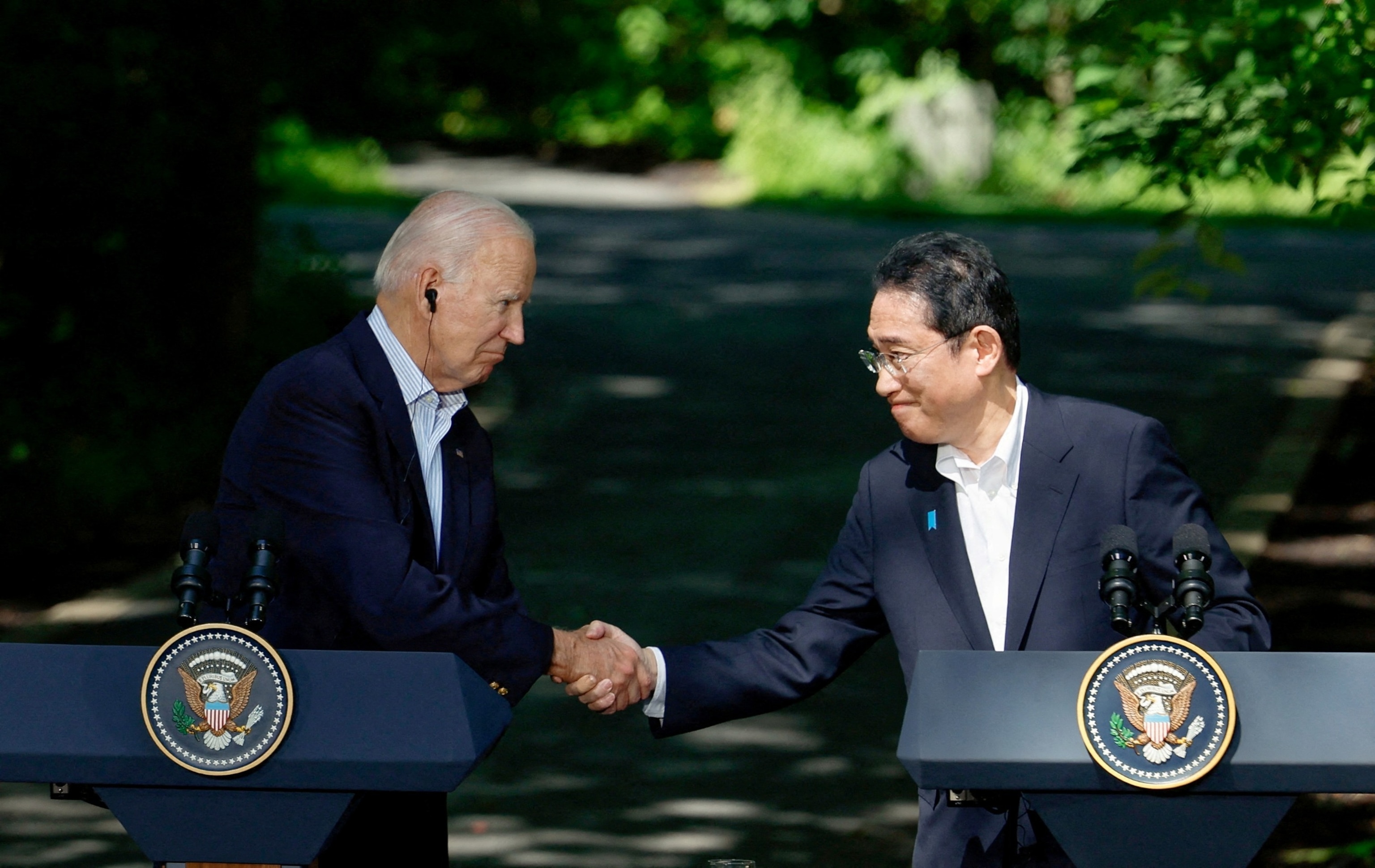 PHOTO: Japanese Prime Minister Fumio Kishida shakes hands with President Joe Biden during a joint press conference at Camp David, August 18, 2023.