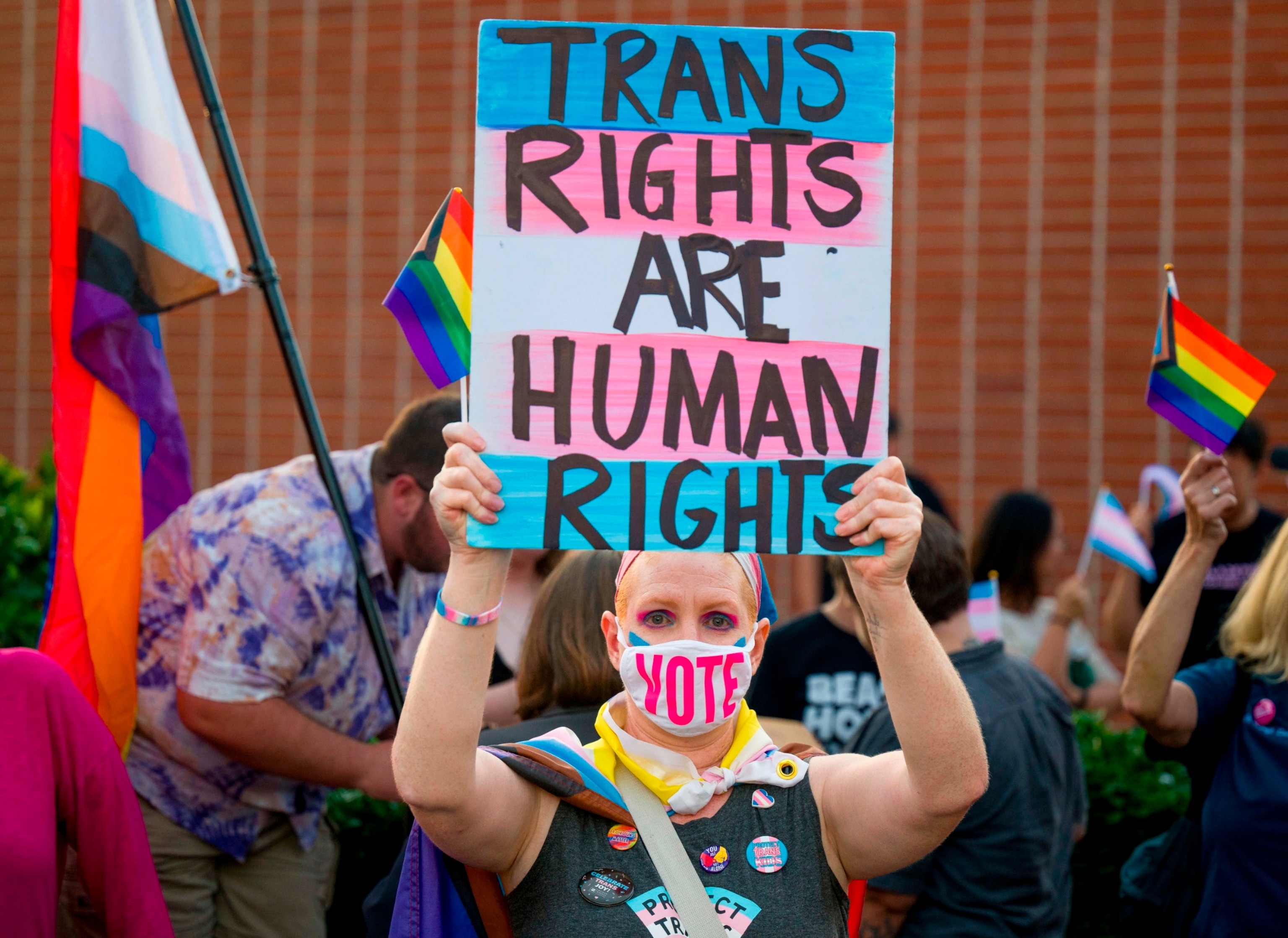 PHOTO: A teacher in Santa Ana and a parent of transgender child protests against the transgender notification policy outside the Orange Unified School District in Orange on Sept. 7, 2023. 