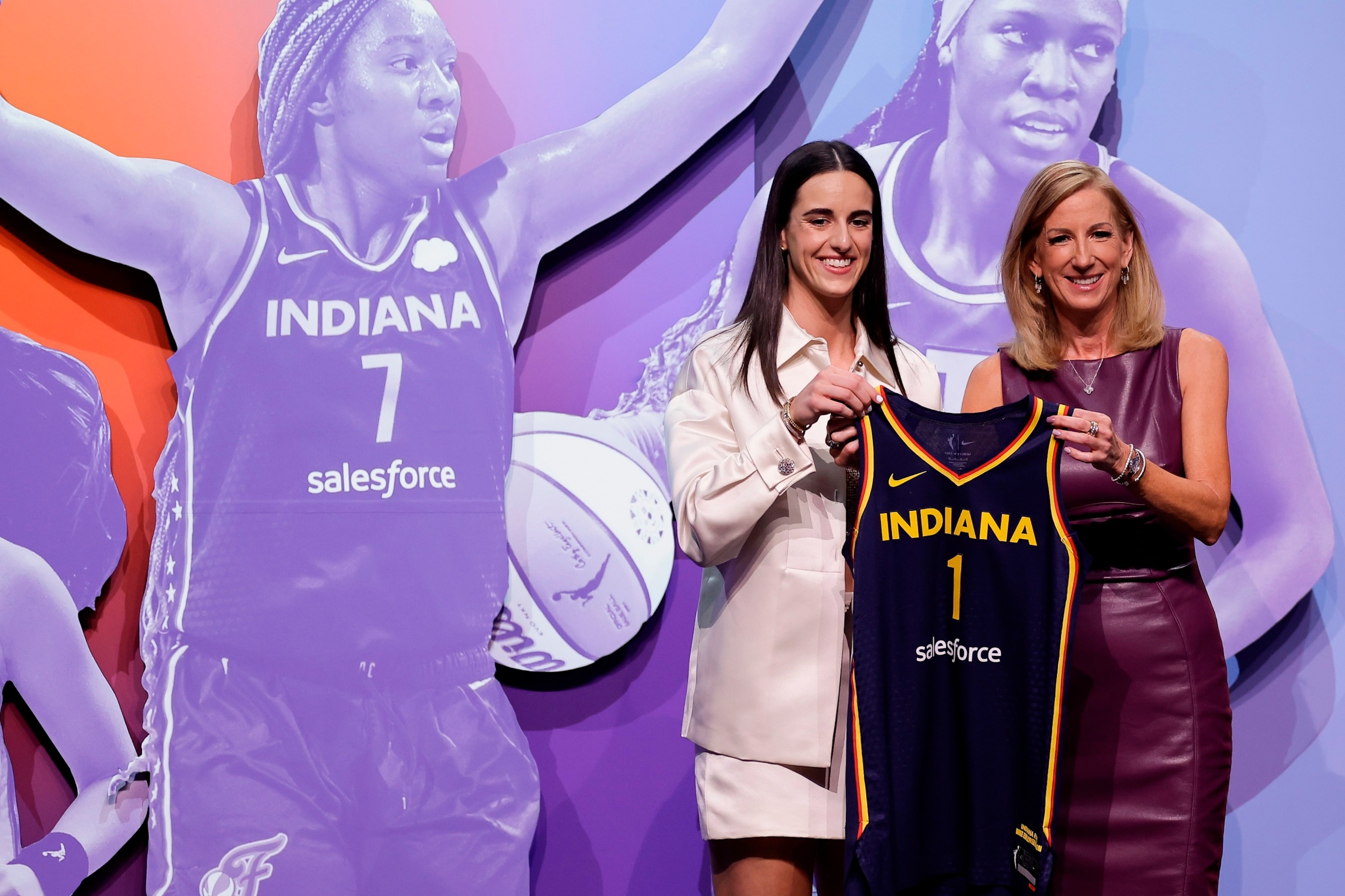 PHOTO: Iowa's Caitlyn Clark, left, poses for a photo with WNBA commissioner Cathy Engelbert after being selected first overall by the Indiana Fever during the first round of the WNBA basketball draft, April 15, 2024, in New York.