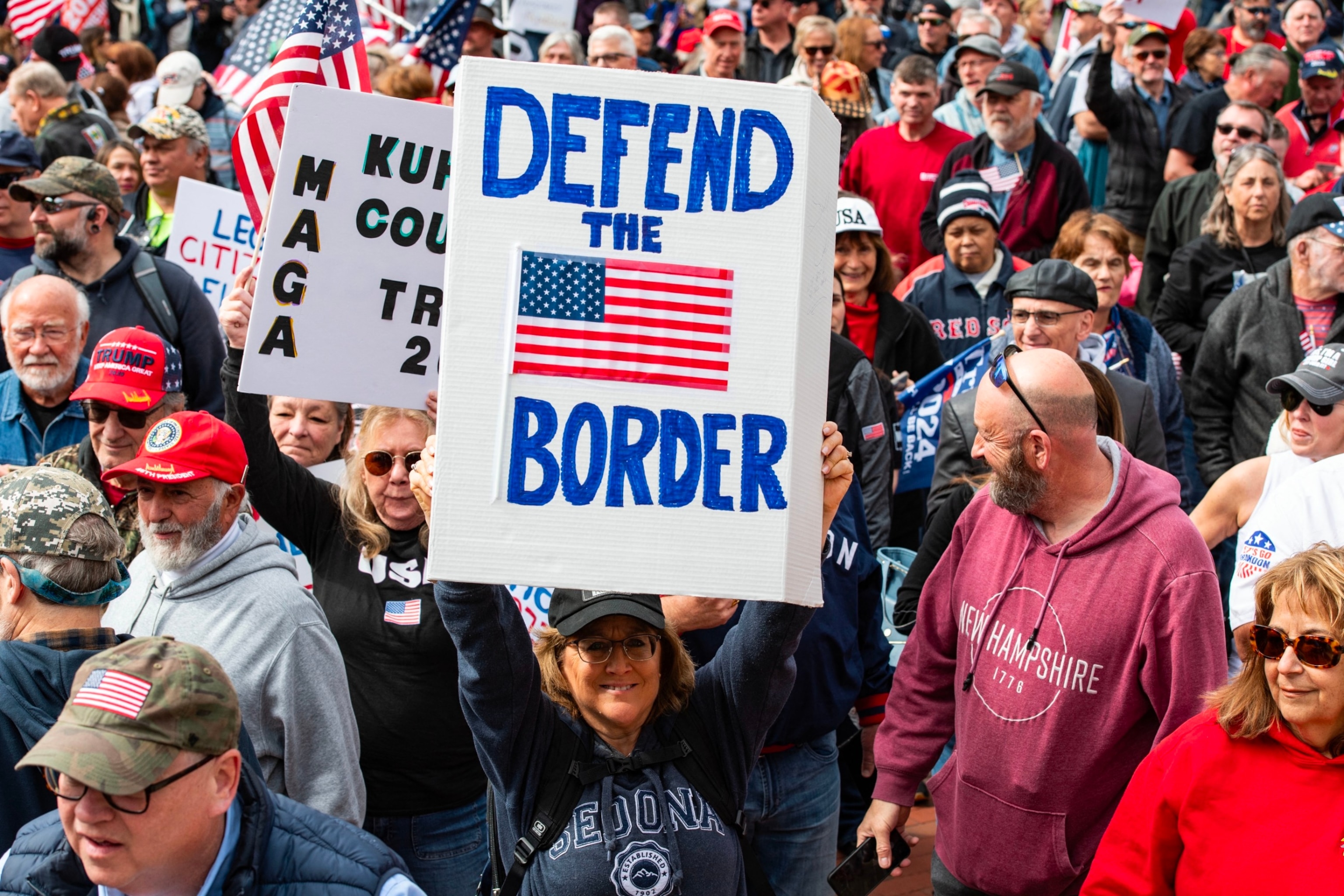 PHOTO: People hold signs and flags at a "close the border" rally in Boston, MA, May 4, 2024. 