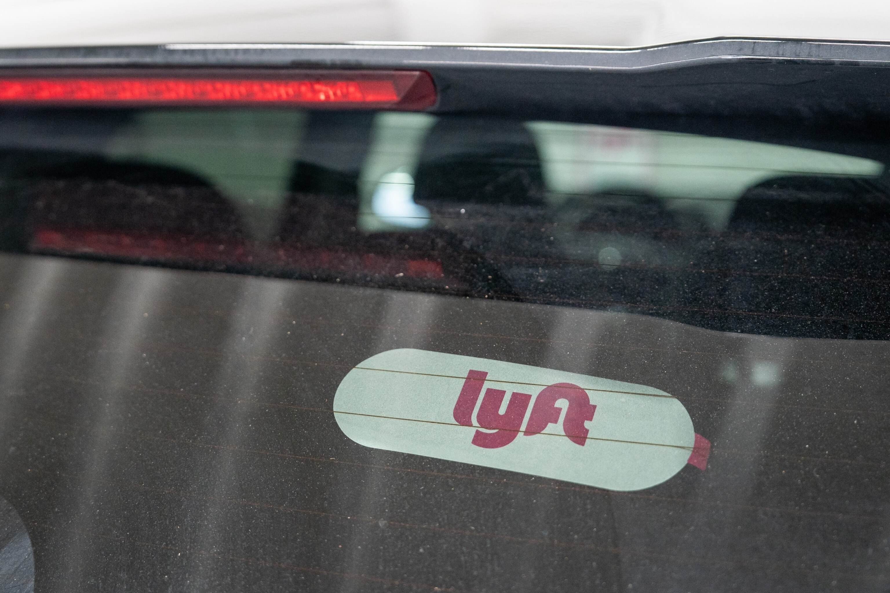 PHOTO: Lyft signage on a car in San Francisco, Feb. 8, 2024.