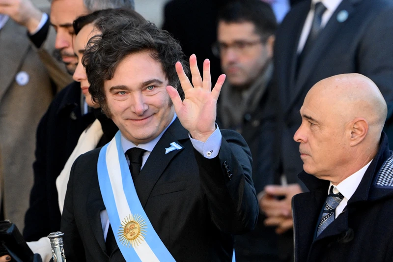 ARGENTINA-POLITICS-TEDEUM-MILEI
Argentina's President Javier Milei waves to media as he arrives to the Metropolitan Cathedral in Buenos Aires on May 25, 2024, to attend a Te Deum in commemoration of the 214th anniversary of the May Revolution that led to the independence of Argentina from Spain. (Photo by Luis ROBAYO / AFP) (Photo by LUIS ROBAYO/AFP via Getty Images)