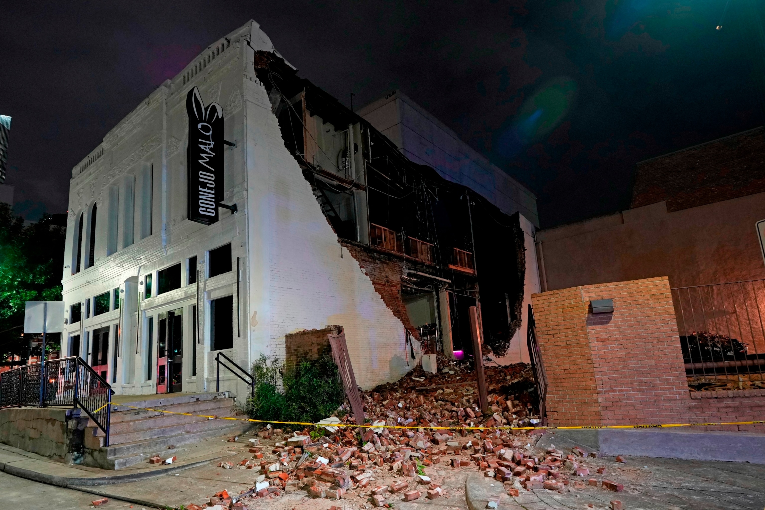 PHOTO: A damaged building is shown in the aftermath of a severe thunderstorm that passed through downtown, May 16, 2024, in Houston. 