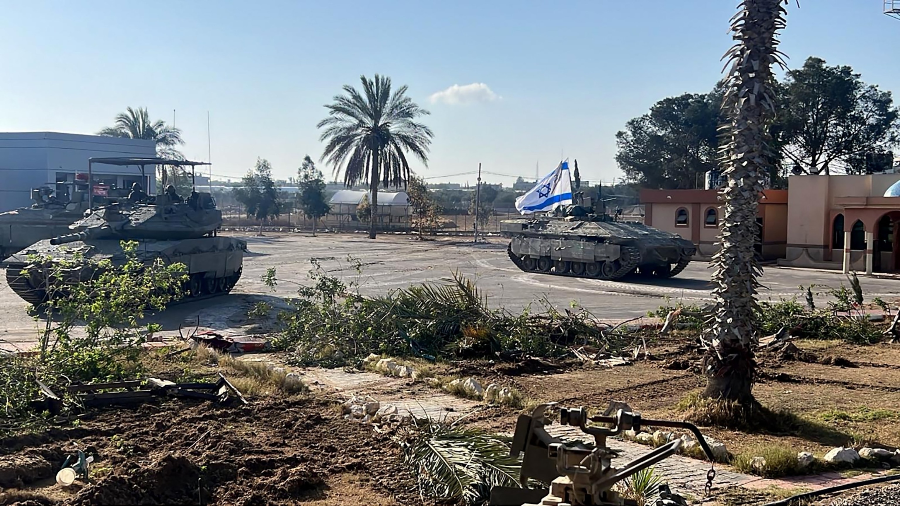 PHOTO: This handout picture released by the Israeli army shows the 401st Brigade's combat team tanks entering the Palestinian side of the Rafah border crossing between Gaza and Egypt in the southern Gaza Strip, on May 7, 2024. 