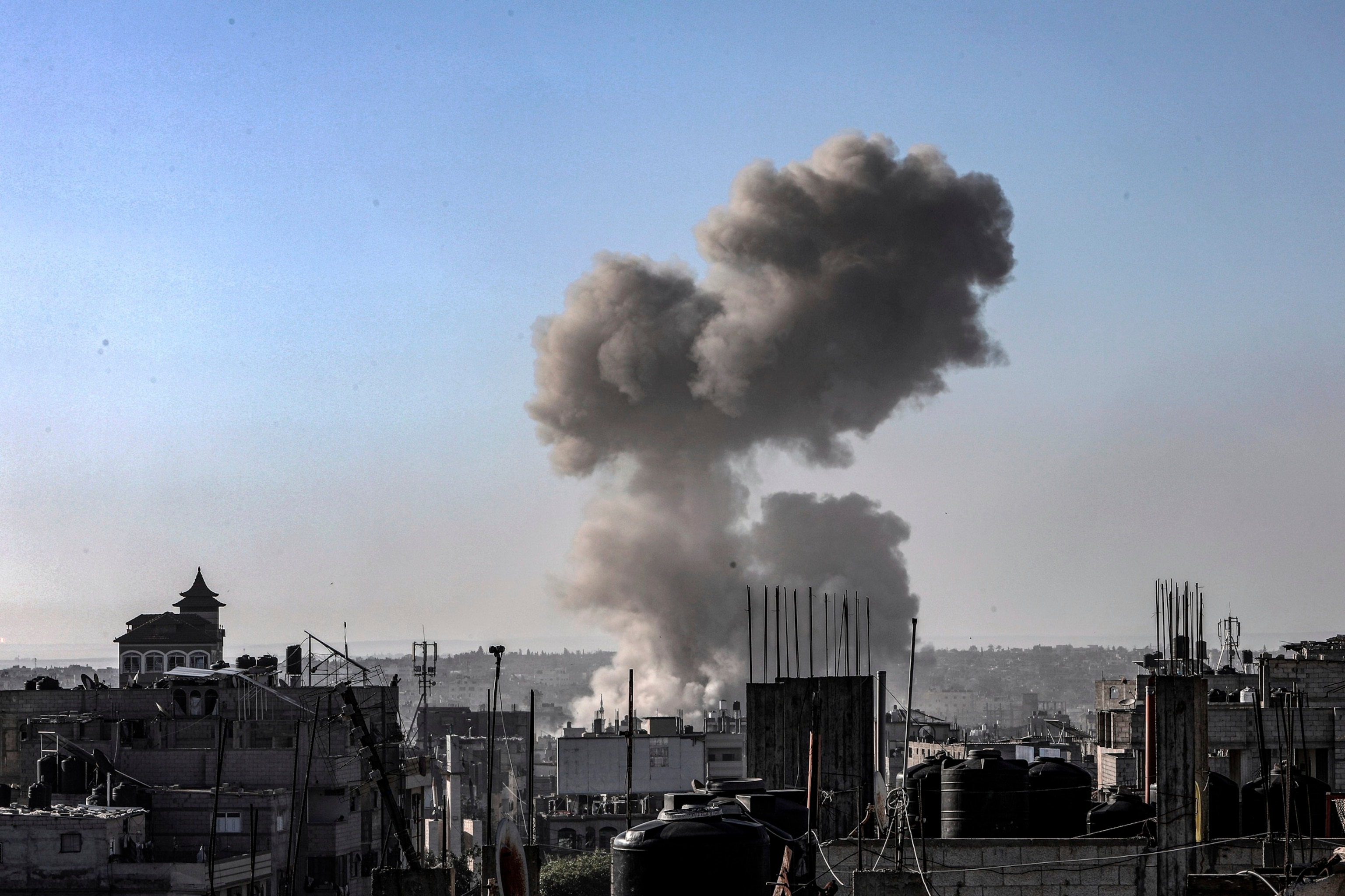 PHOTO: Smoke rises following Israeli air strikes on Al-Jeneina and Al-Salam neighbourhoods in Rafah, on May 8, 2024.