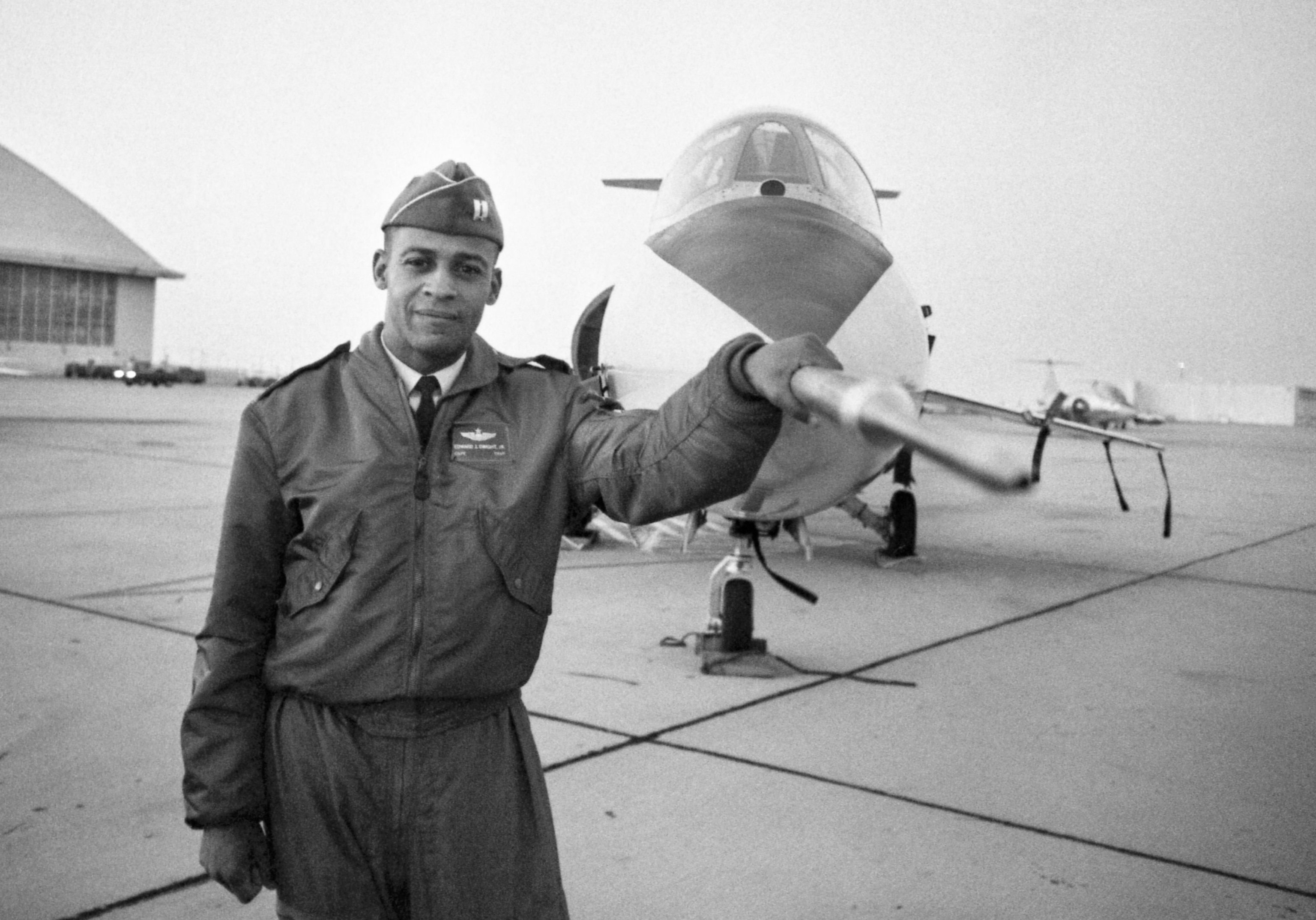 PHOTO: Captain Ed Dwight stands in front of an F-104 jet fighter.