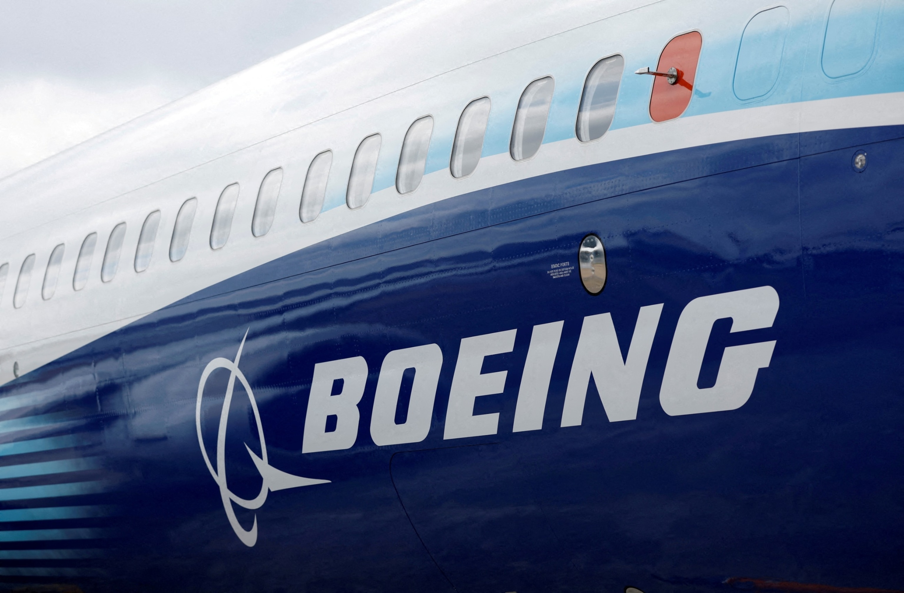 PHOTO:The Boeing logo is seen on the side of a Boeing 737 MAX at the Farnborough International Airshow, in Farnborough, Britain, July 20, 2022. 