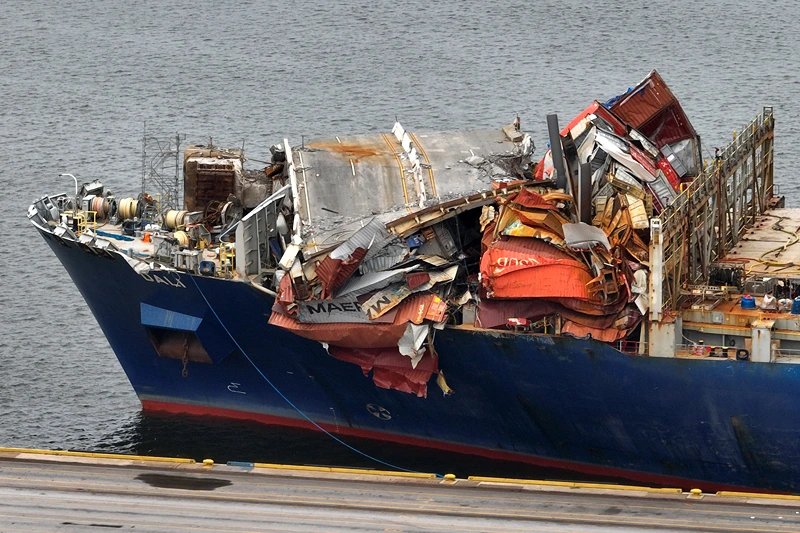 Container Ship Dali Moved From Site Of Francis Scott Key Bridge Collapse
BALTIMORE, MARYLAND - MAY 20: In this aerial view, portions of the Francis Scott Key Bridge remain lapped over the bow of the damaged container ship Dali after it was docked at the Seagirt Marine Terminal on May 20, 2024 in Baltimore, Maryland. On March 26th the Dali crashed into the bridge, causing it to collapse killing six construction workers, and closing the Patapsco River and the Port of Baltimore for weeks. (Photo by Chip Somodevilla/Getty Images)