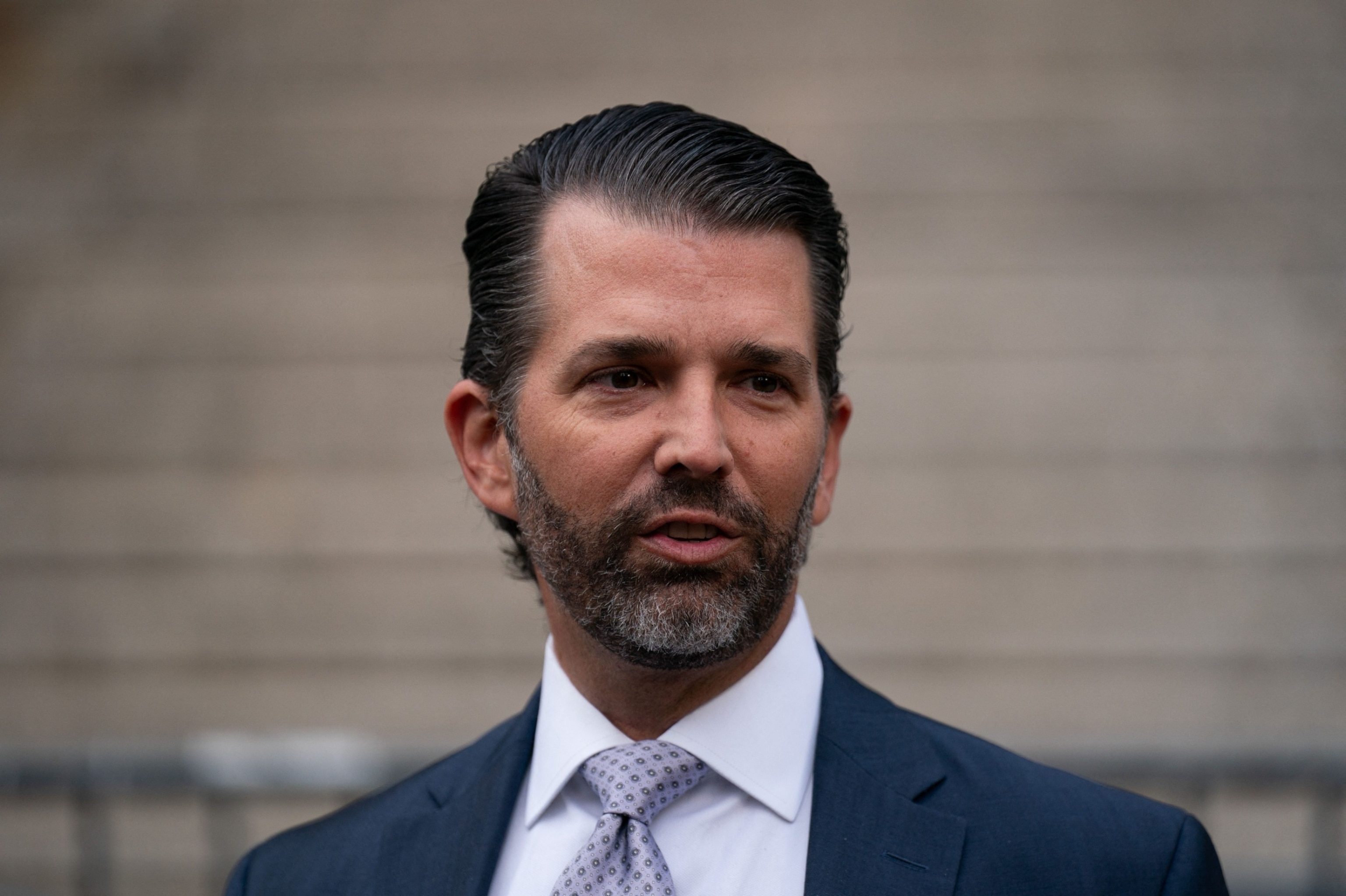 PHOTO: Donald Trump Jr. speaks to members of the media while departing after testifying during the Trump Organization civil fraud trial at the New York State Supreme Court in New York City on Nov. 13, 2023.