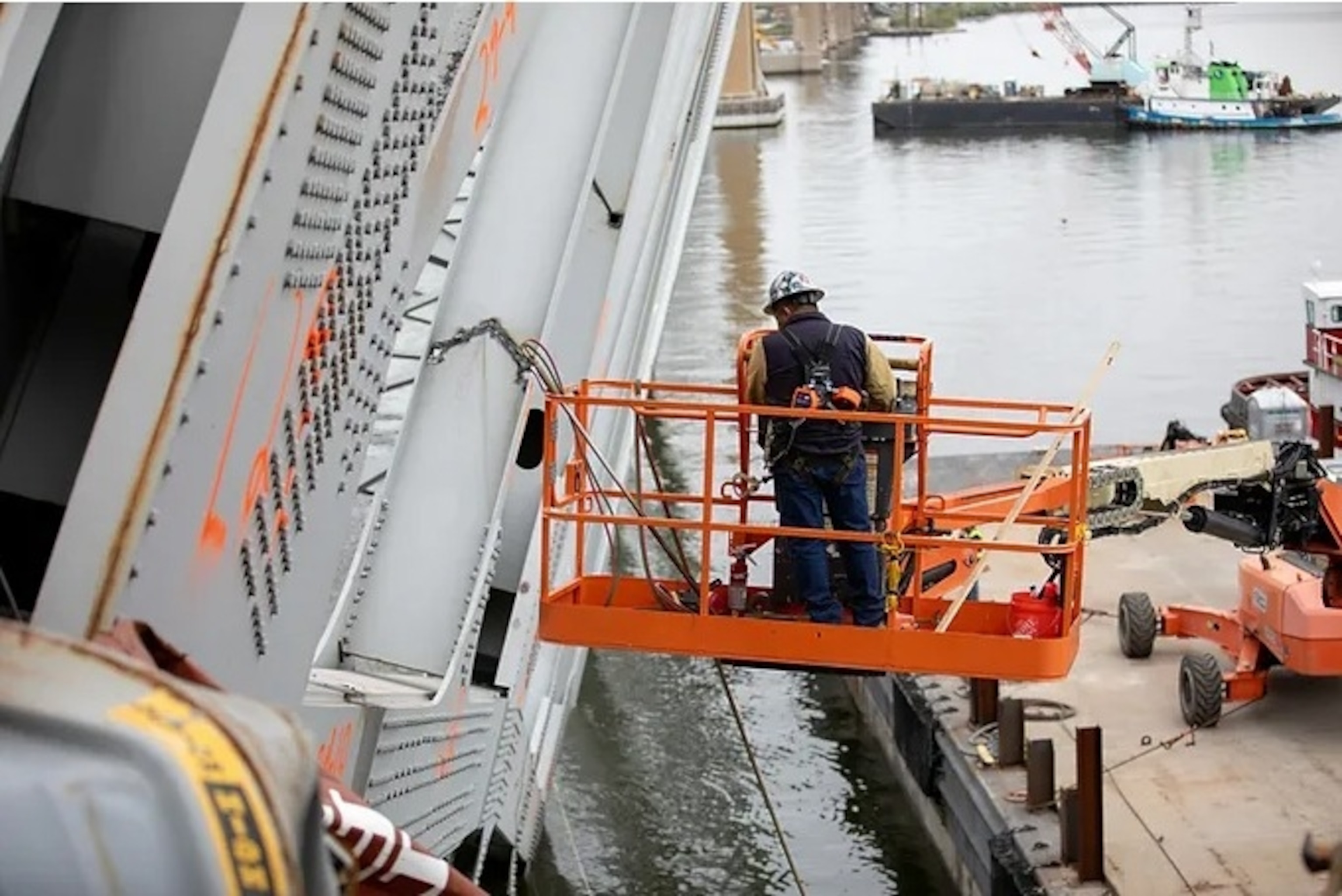 PHOTO: Salvors with the Unified Command prepare charges for upcoming precision cuts to remove section 4 from the port side of the bow of the M/V DALI, April 21, 2024, during the Key Bridge Response 2024.