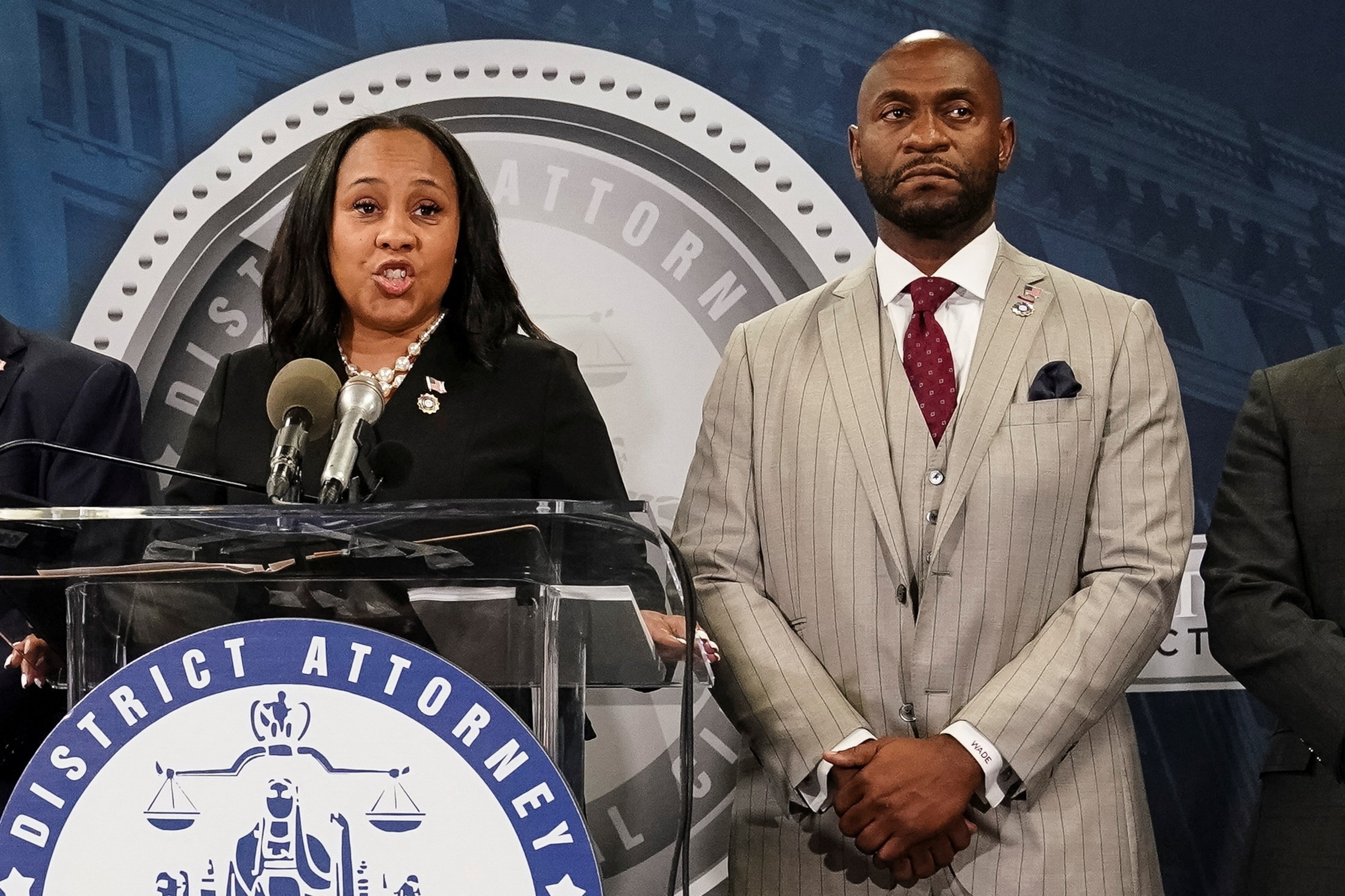 PHOTO: Fulton County District Attorney Willis speaks at a press conference next to prosecutor Wade after a Grand Jury brought back indictments against Trump and allies in their attempt to overturn the state's 2020 election results, Atlanta, Aug. 14, 2023.