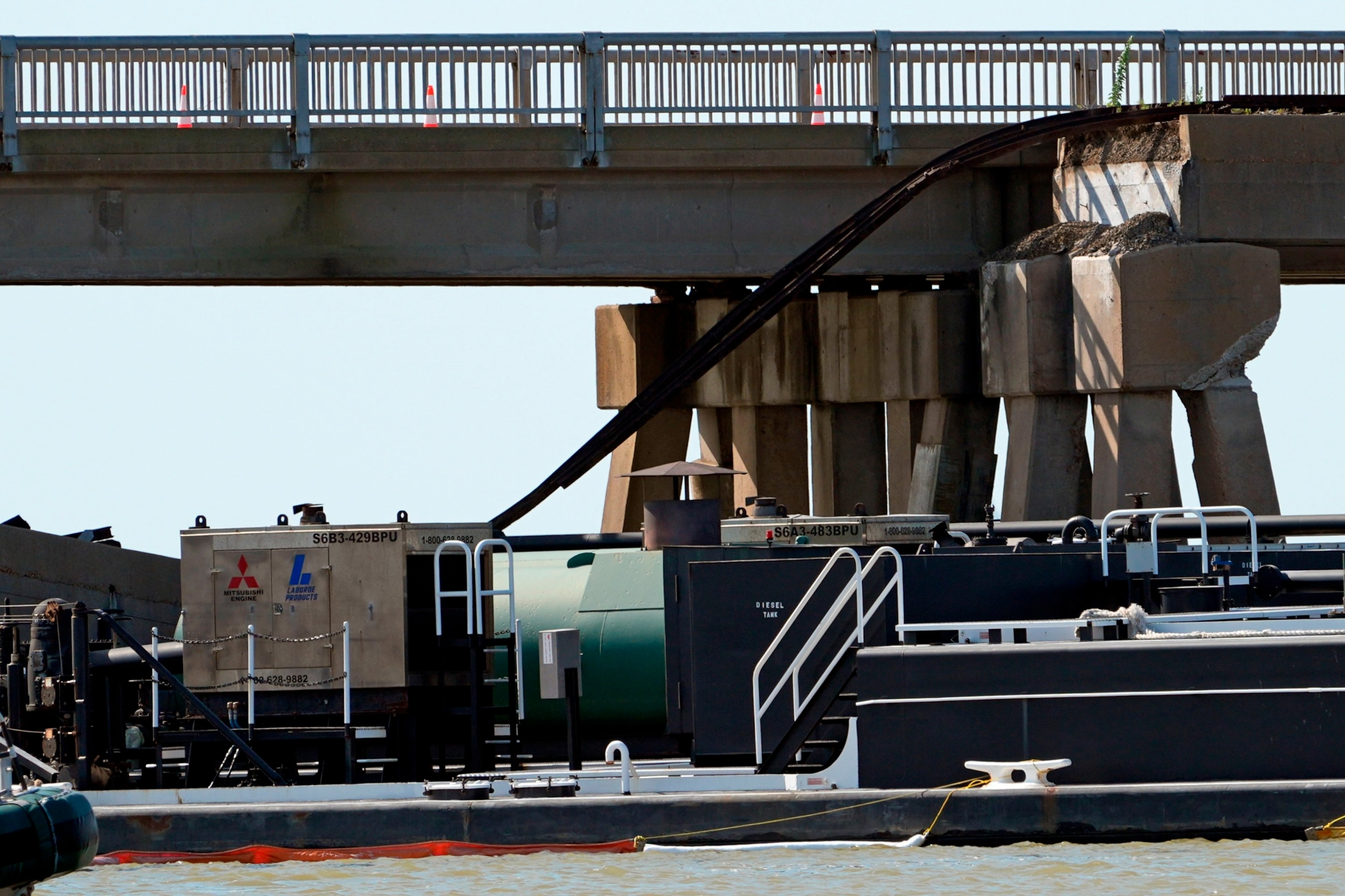 PHOTO: A section of railroad track hangs down from Pelican Island Bridge after a barge crashed into the bridge, May 15, 2024, in Galveston, Texas.