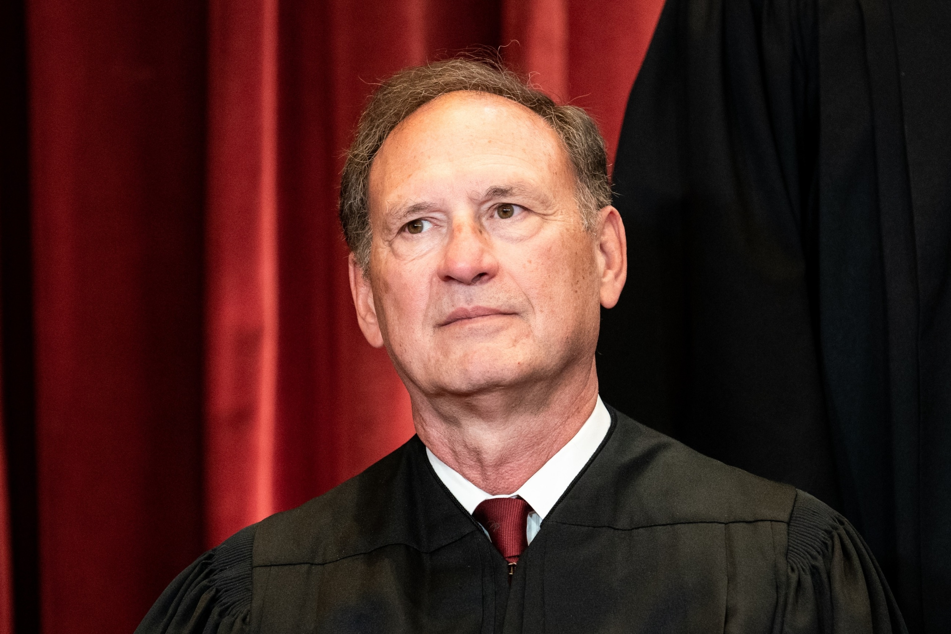 PHOTO: Associate Justice Samuel Alito sits during a group photo of the Justices at the Supreme Court in Washington, DC, April 23, 2021. 