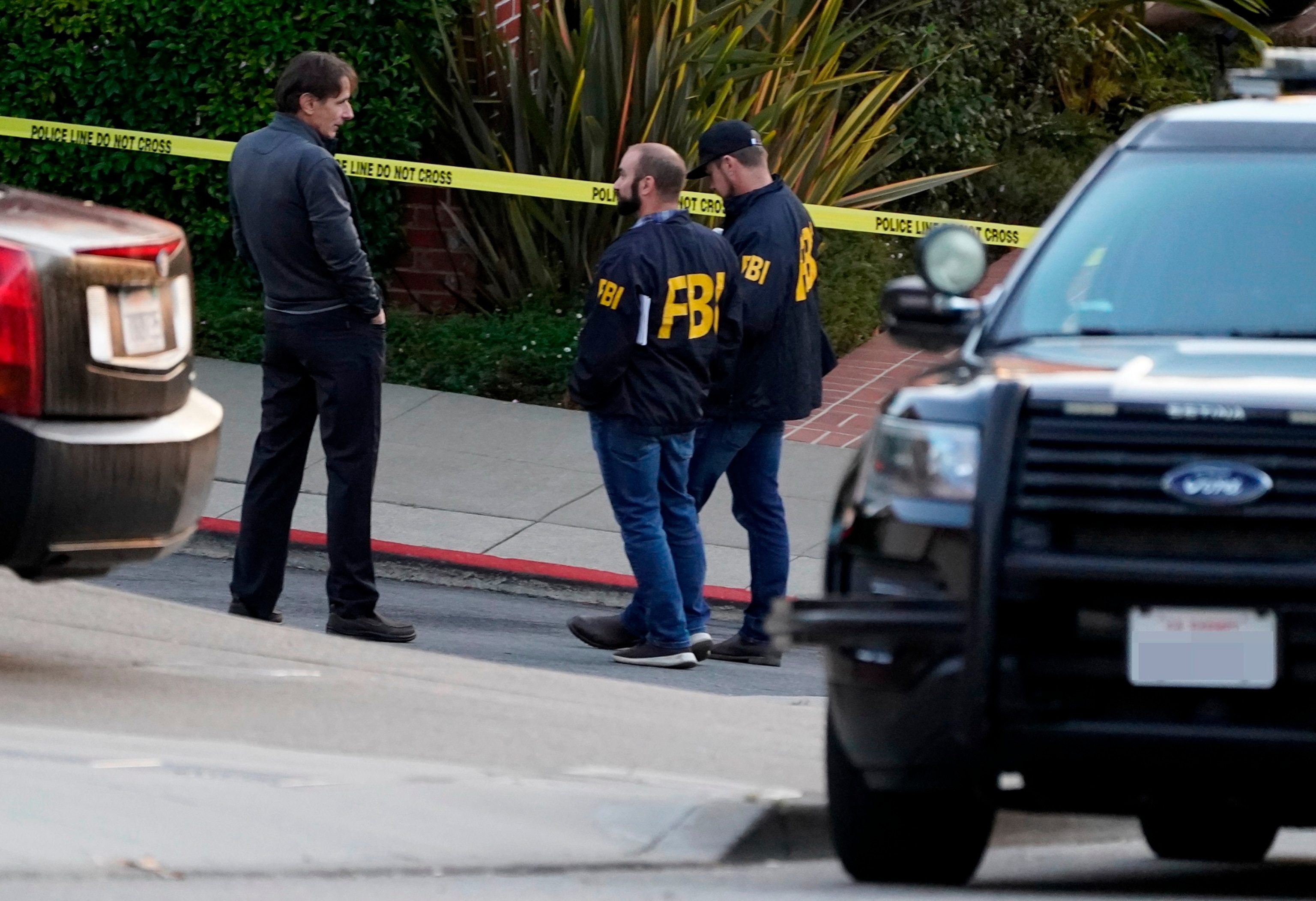 PHOTO: In this Oct. 28, 2022, file photo, a pair of FBI agents work outside the home of House Speaker Nancy Pelosi and her husband Paul Pelosi in San Francisco.