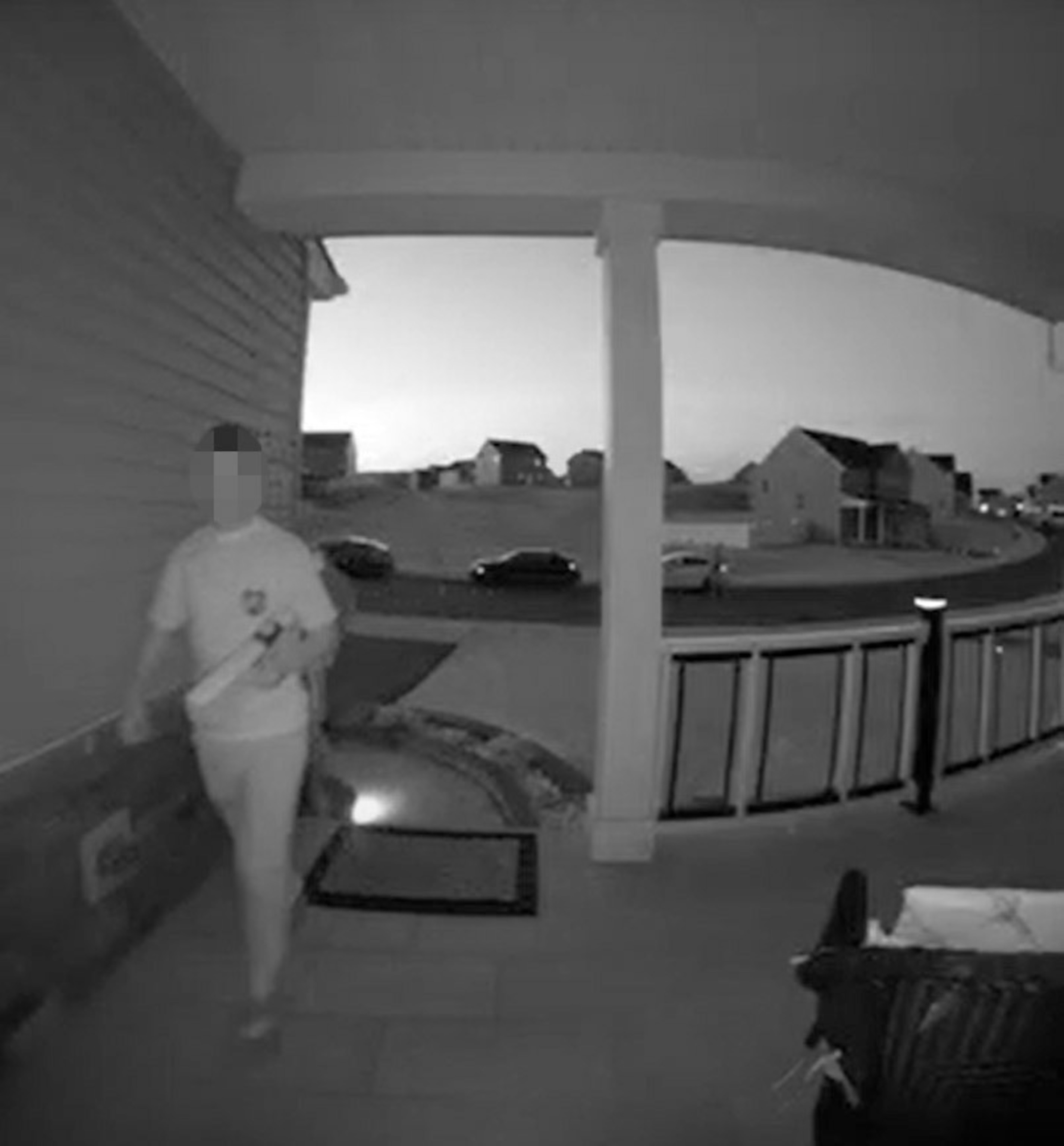 PHOTO: Home security video shows a teen holding what appears to be a toy gun while ringing on Justin Johnson's doorbell on April 26.