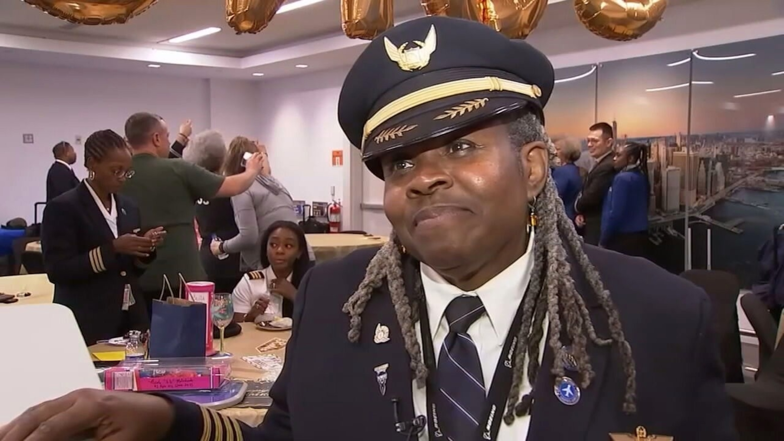 PHOTO: In this screen grab from a video, United Airlines pilot Theresa Claiborne is shown at her retirement party.