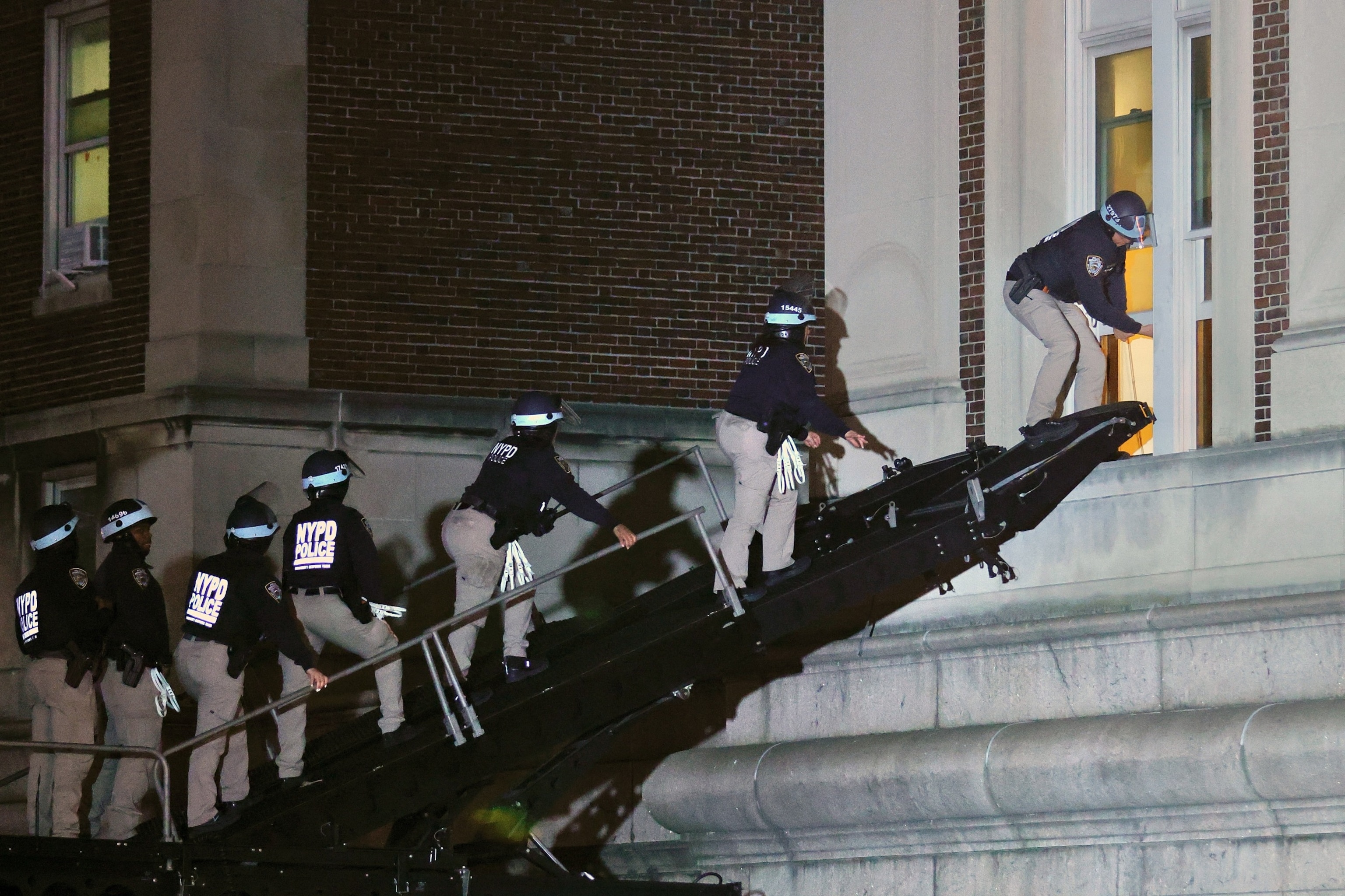 PHOTO: NYPD officers in riot gear break into a building at Columbia University, where pro-Palestinian students are barricaded inside a building and have set up an encampment, in New York, April 30, 2024.