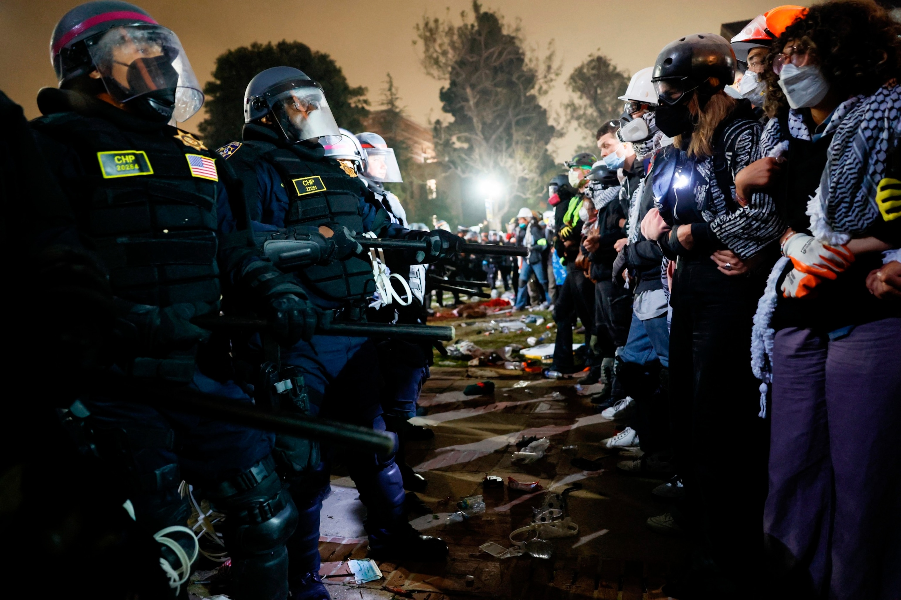 PHOTO: Police face-off with pro-Palestinian students after destroying part of the encampment barricade on the campus of the University of California, Los Angeles (UCLA) in Los Angeles, May 2, 2024.