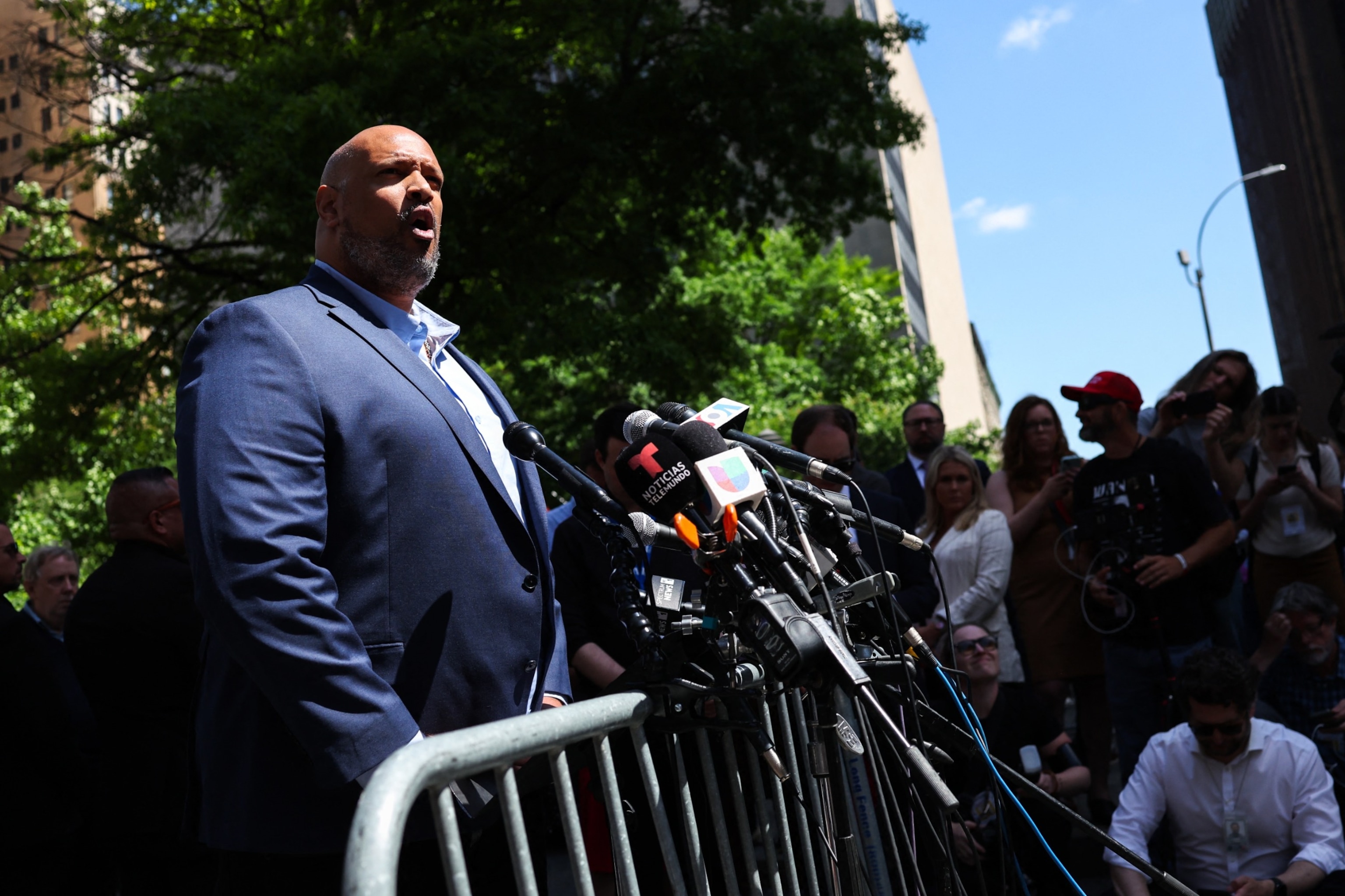 PHOTO: Former U.S. Capitol Police officer Harry Dunn speaks to the press outside of Manhattan Criminal Court as former US President and Republican presidential candidate Donald Trump attends his criminal trial in New York City, May 28, 2024. 