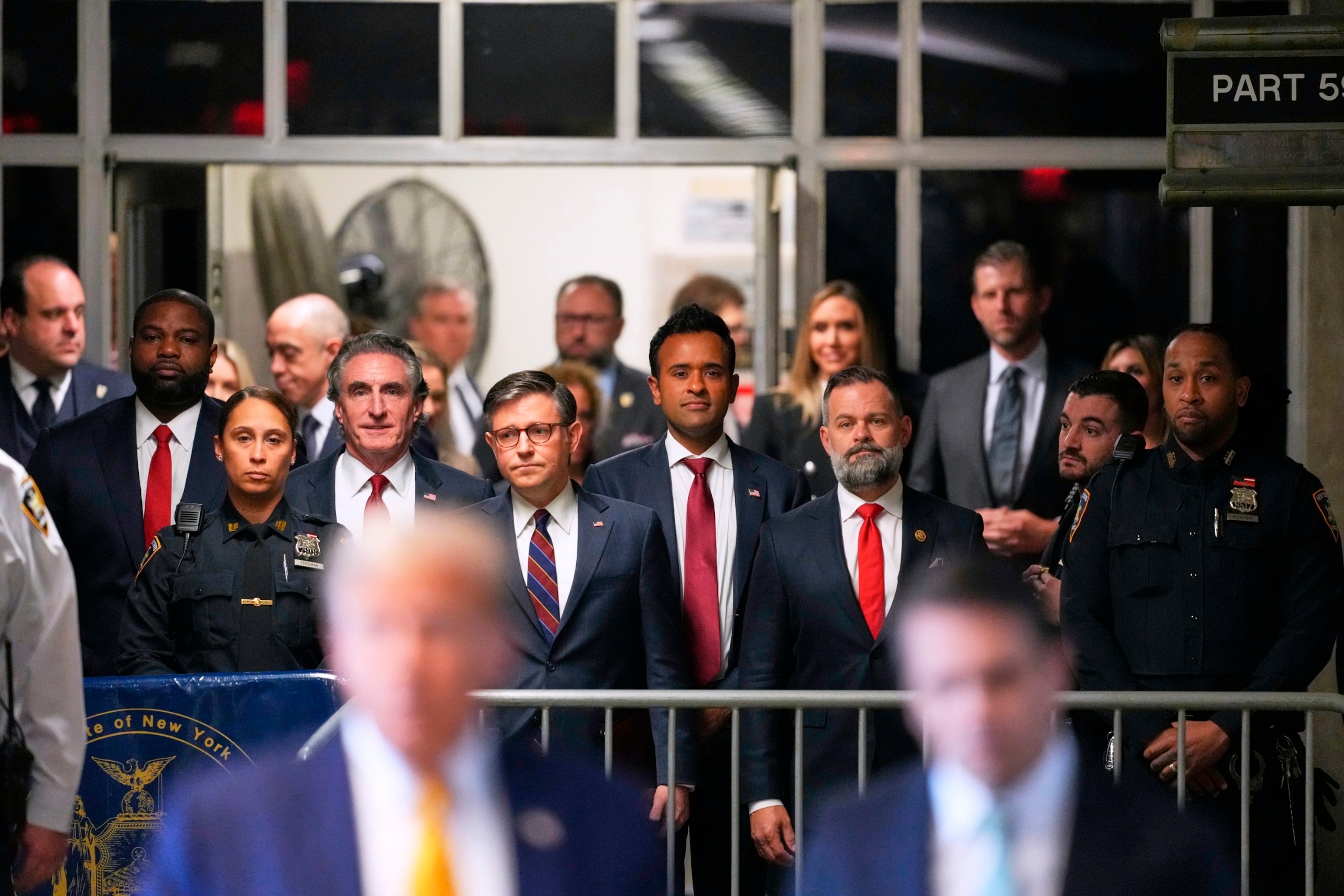 PHOTO: Doug Burgum, Speaker of the House Mike Johnson and Vivek Ramaswamy look on as former President Donald Trump talks to the media outside Manhattan criminal court in New York, May 14, 2024. 