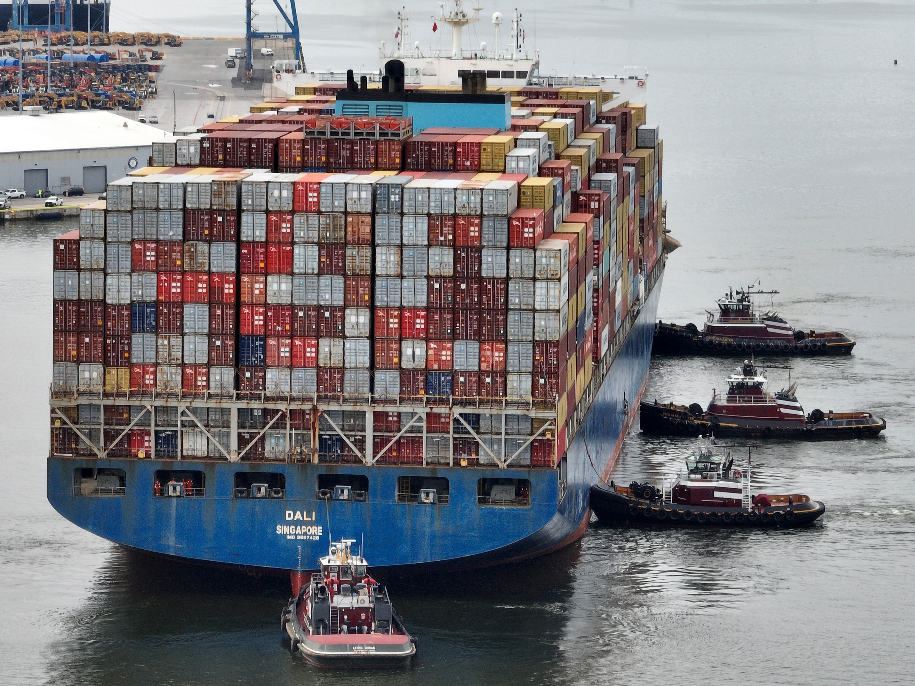 PHOTO: Tugboats maneuver the damaged container ship Dali through the Port of Baltimore and into the Seagirt Marine Terminal, May 20, 2024, in Baltimore, Md. 