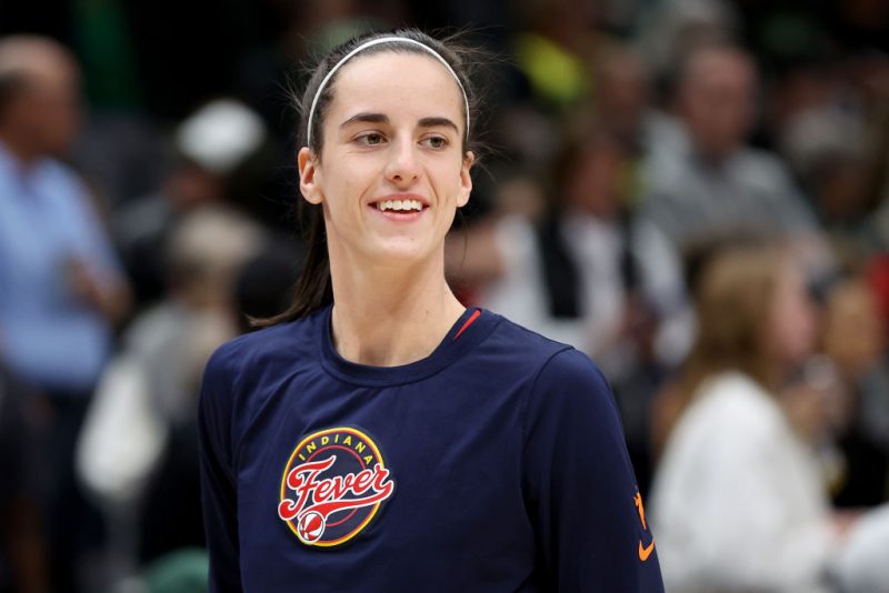 SEATTLE, WASHINGTON - MAY 22: Caitlin Clark #22 of the Indiana Fever looks on against the Seattle Storm at Climate Pledge Arena on May 22, 2024 in Seattle, Washington. NOTE TO USER: User expressly acknowledges and agrees that, by downloading and or using this photograph, User is consenting to the terms and conditions of the Getty Images License Agreement. (Photo by Steph Chambers/Getty Images)