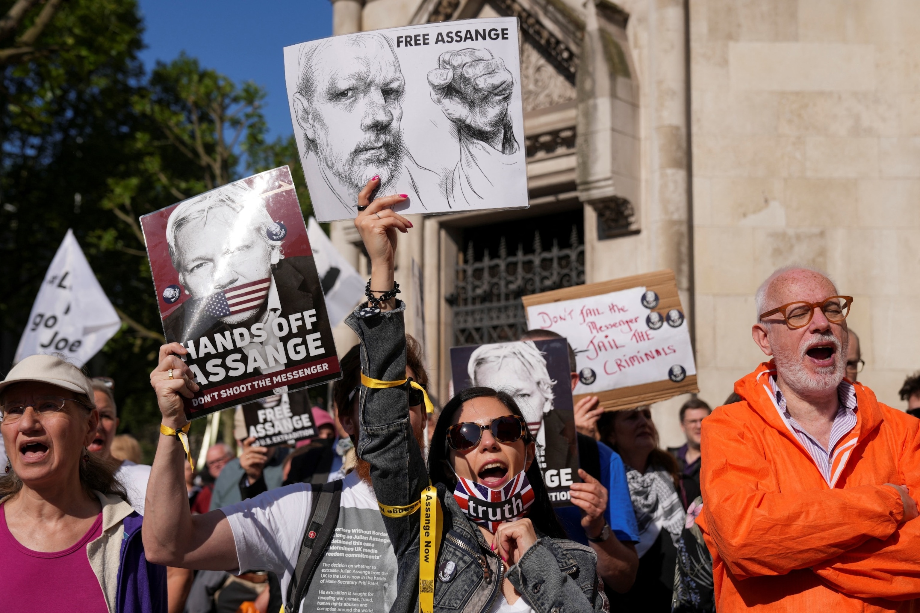 PHOTO: People attend a protest outside the High Court on the day of an extradition hearing of WikiLeaks founder Julian Assange, in London, Britain, May 20, 2024.