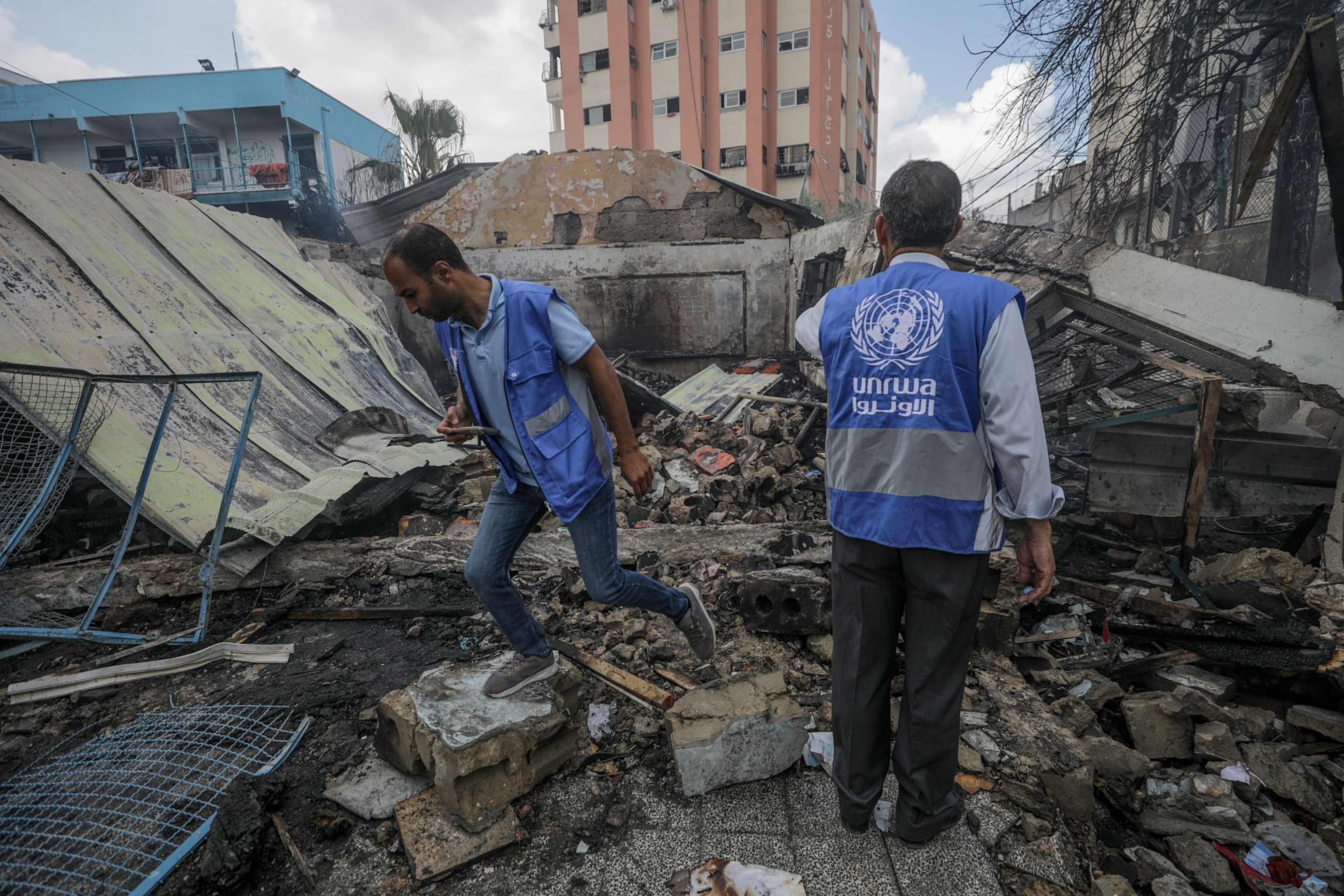 PHOTO: UNRWA employees inspect a destroyed United Nations school following an air strike in Al Nuseirat refugee camp, central Gaza Strip, May 14, 2024. 