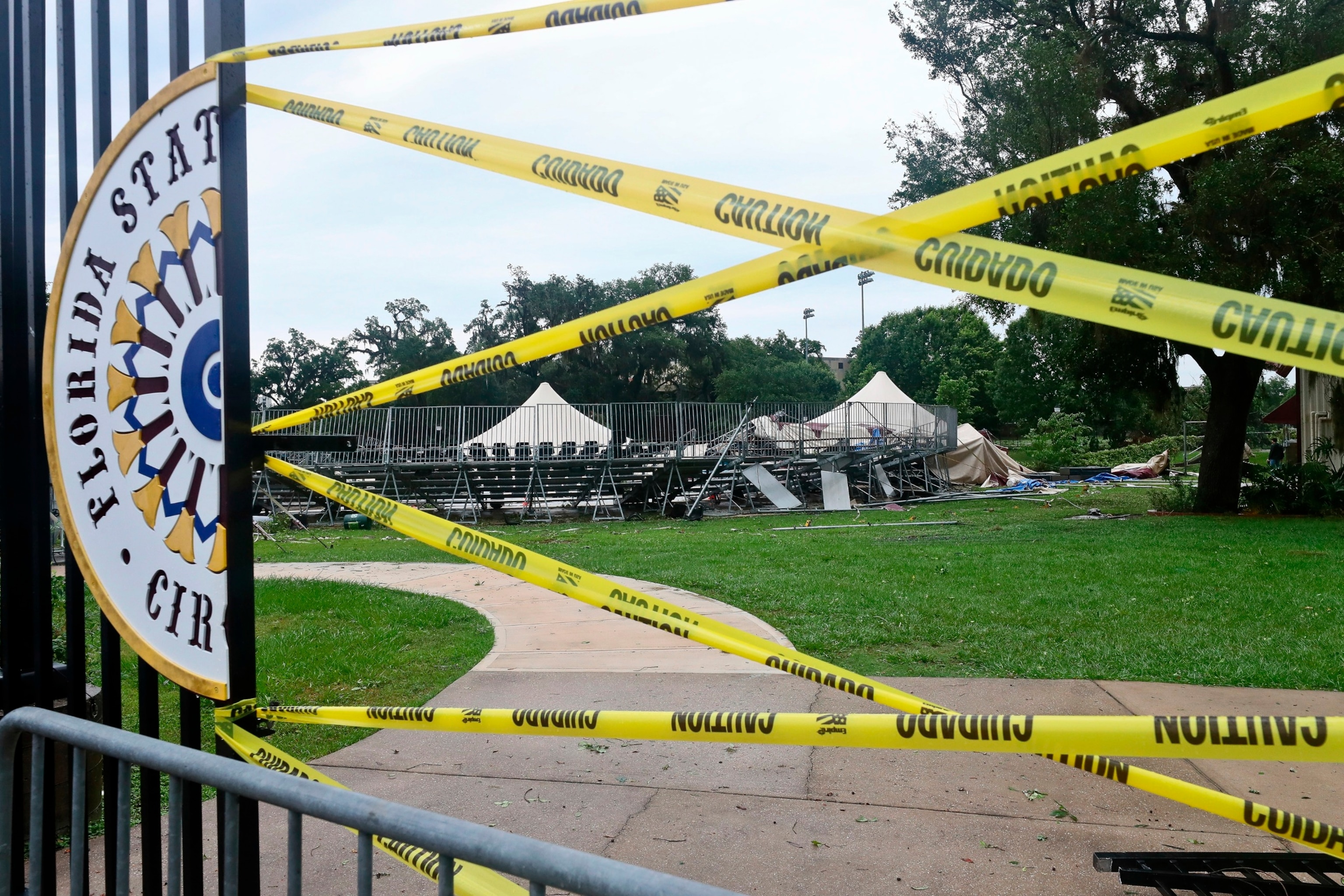 PHOTO: Caution tape blocks the path to Florida State University's Flying Circus bleachers that were damaged when the tent above them collapsed during strong weather in Tallahassee, May 10, 2024.