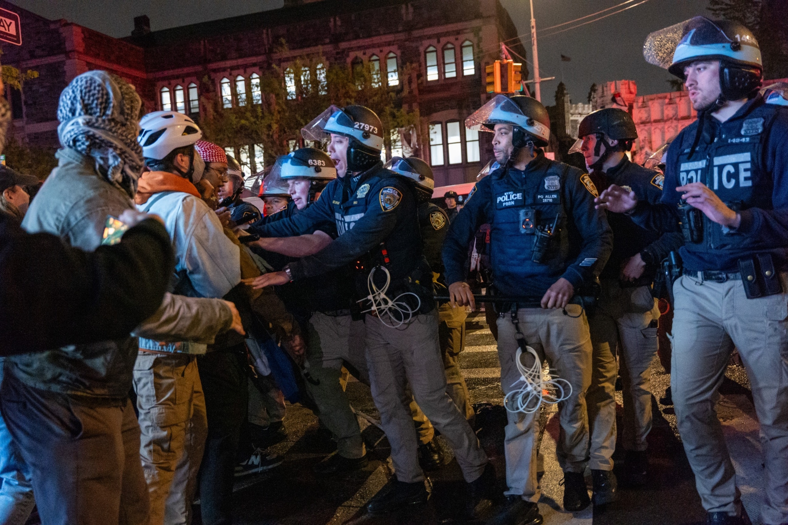 PHOTO: Pro-Palestinian supporters confront police during demonstrations at The City College Of New York (CUNY) as the NYPD cracks down on protest camps at both Columbia University and CCNY on April 30, 2024 in New York City.