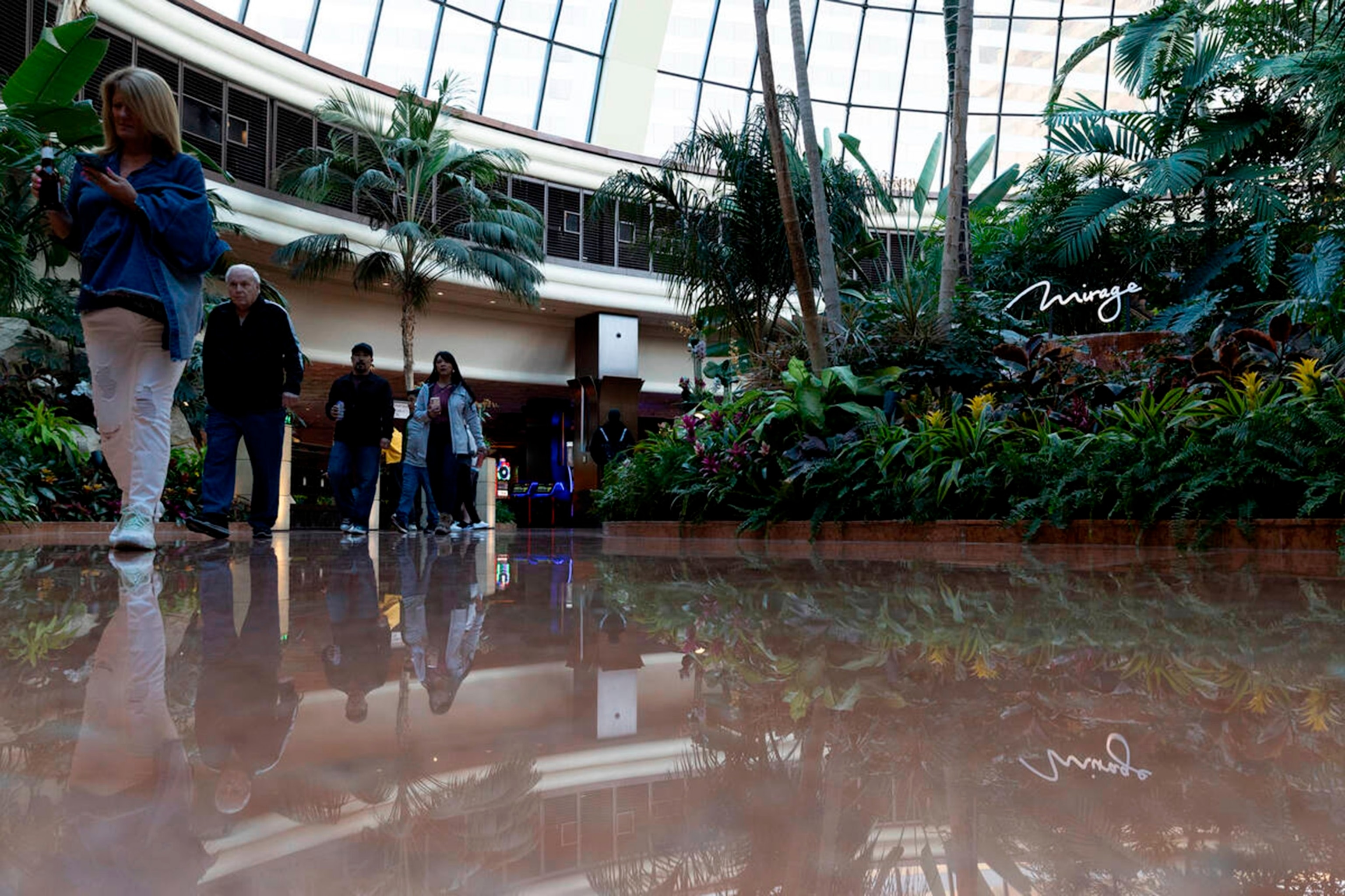 PHOTO: Guests pass through the atrium at The Mirage, March 22, 2023, in Las Vegas. 