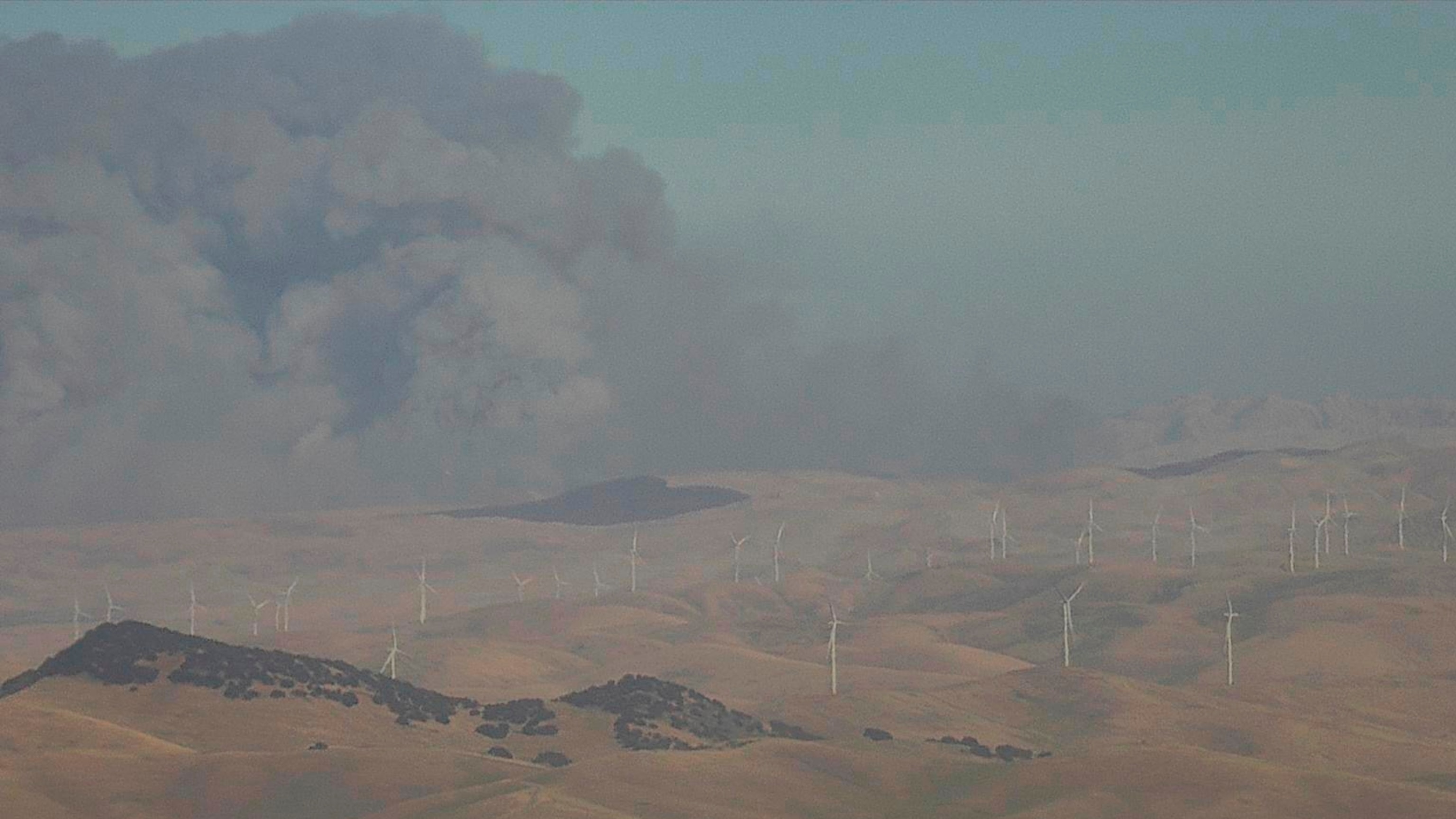 PHOTO: In this image from an AlertCalifornia/UC San Diego monitoring camera, smoke rises from the Corral Fire near the city of Tracy, Calif., Saturday, June 1, 2024. 