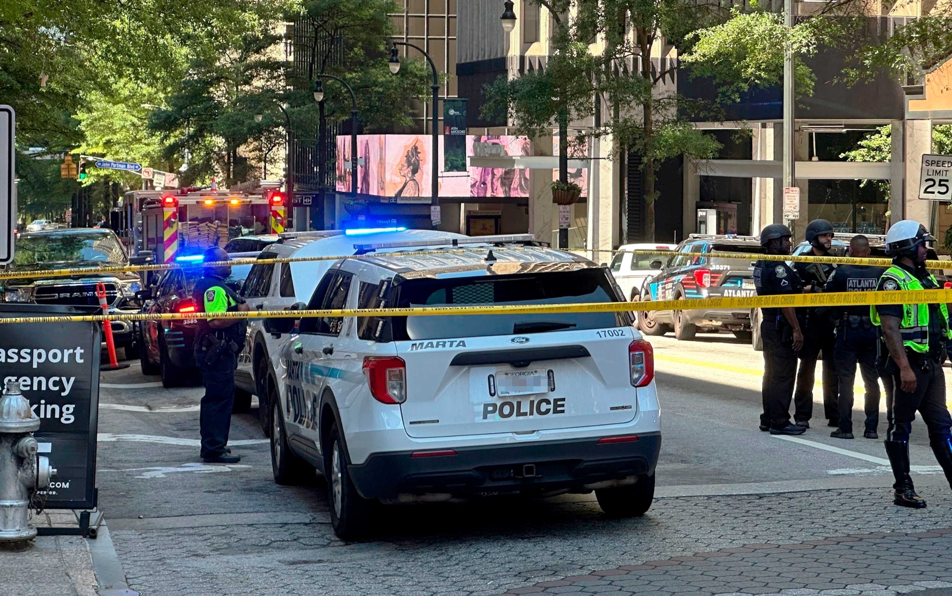 PHOTO: Police respond to the scene of a shooting outside the Peachtree Center complex, on June 11, 2024, in downtown Atlanta.
