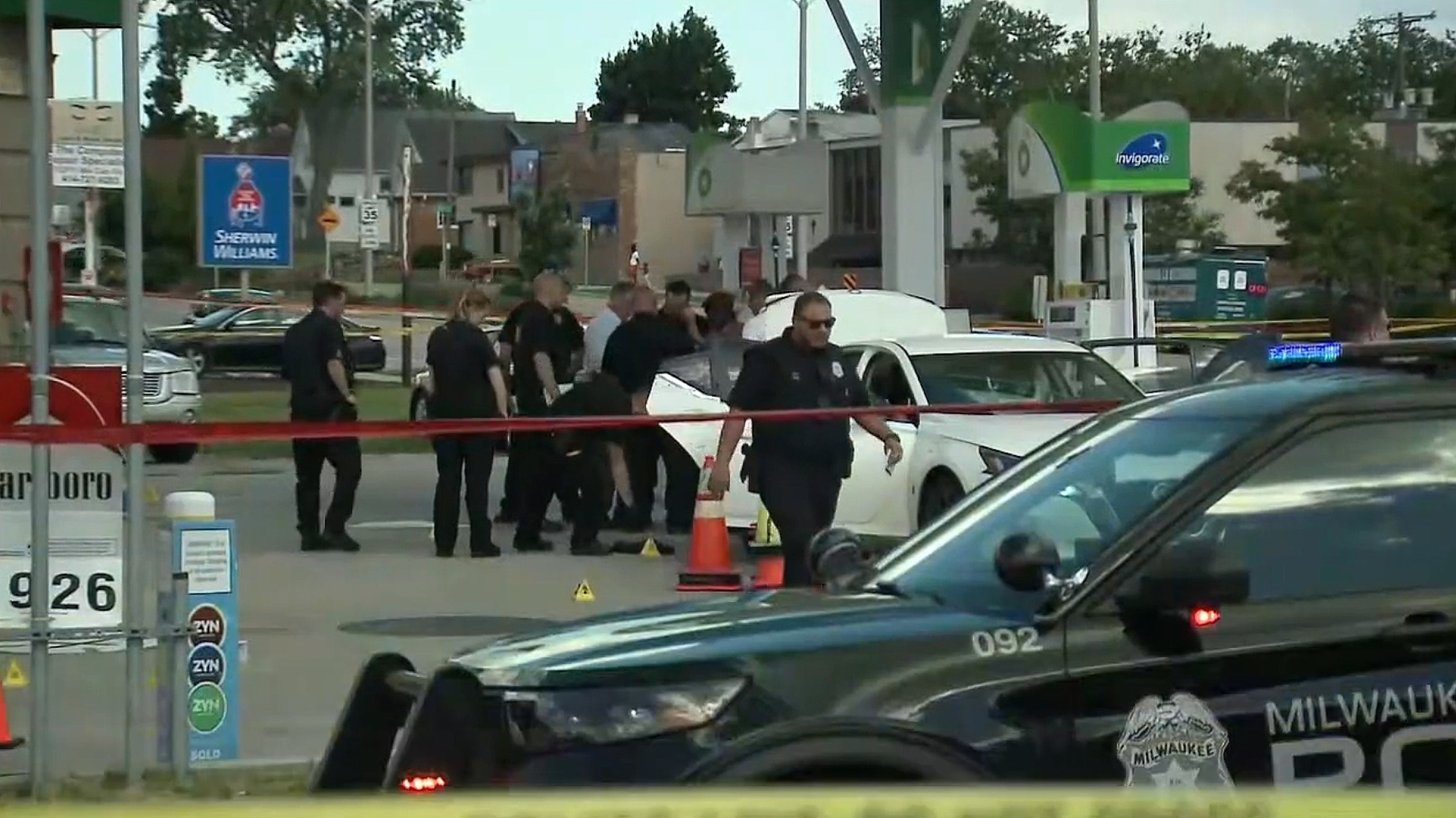 PHOTO: Police monitor the scene of a shooting at a gas station in Milwaukee, WI, June 26, 2024.