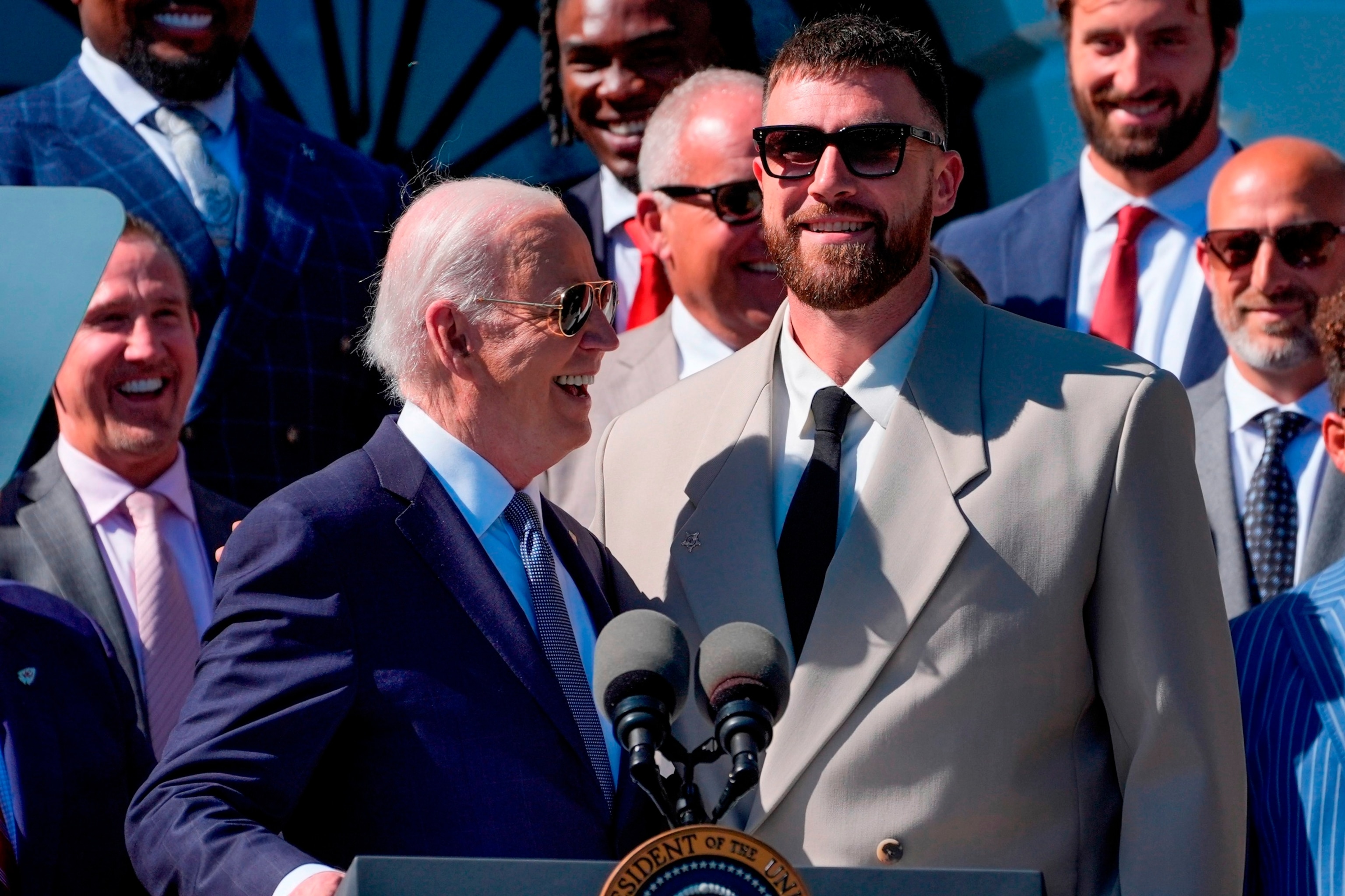 PHOTO: President Joe Biden talks with Kansas City Chiefs tight end Travis Kelce during an event with the Super Bowl-champion Kansas City Chiefs on the South Lawn of the White House, Washington, DC, May 31, 2024.