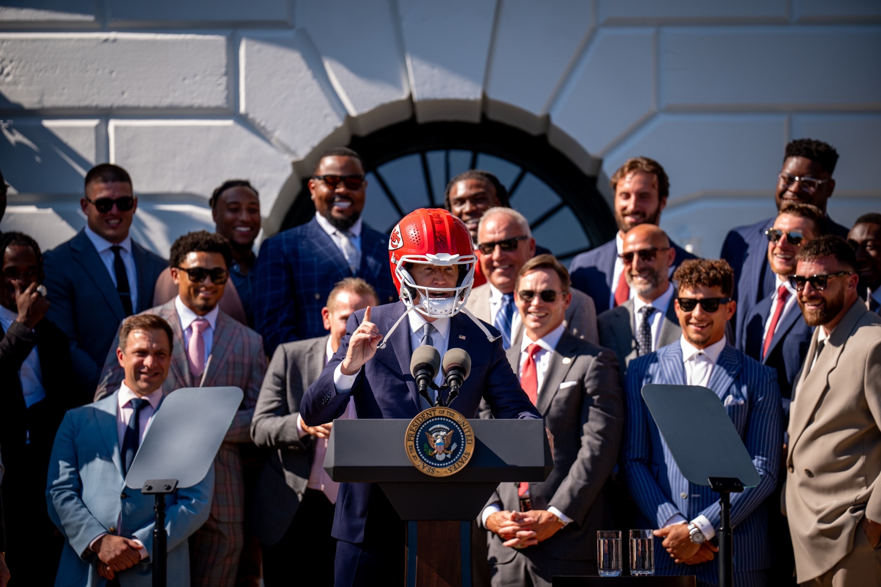 PHOTO: President Joe Biden wears a helmet presented to him by the NFL Super Bowl Champion Kansas City Chiefs as he speaks on the South Lawn of the White House in Washington, DC, May 31, 2024.
