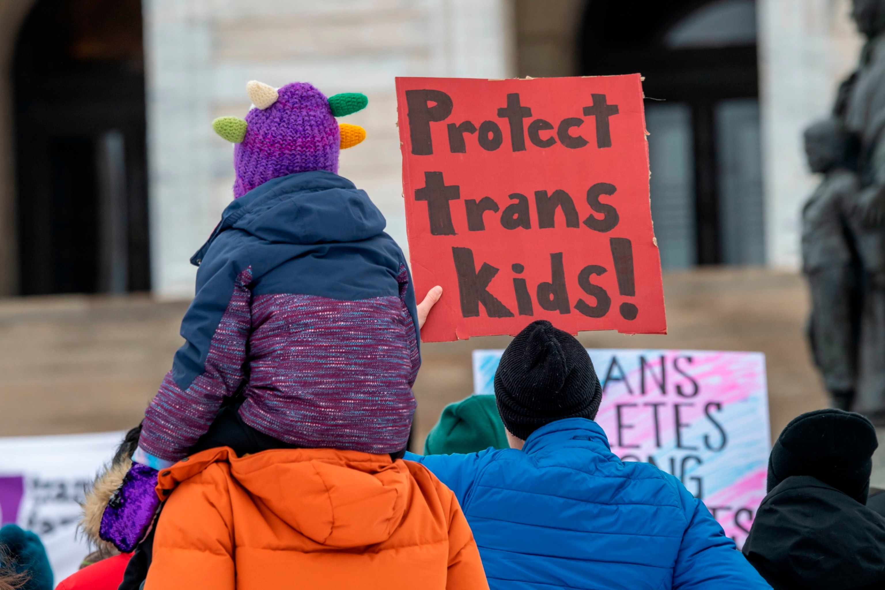 PHOTO: In this March 6, 2022 file photo, Minneasotans hold a rally at the capitol to support trans kids around the country, in St. Paul, Minn.