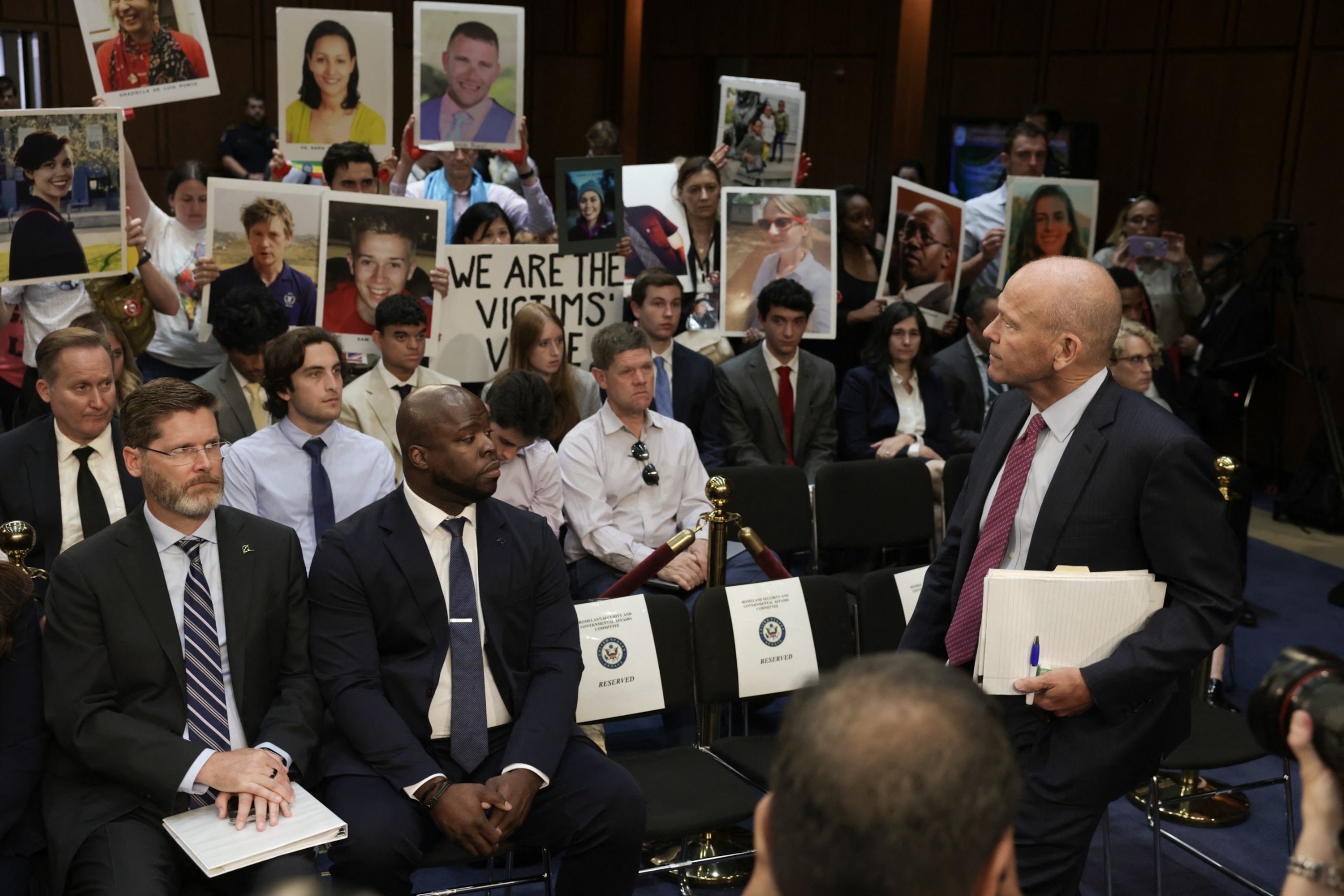 PHOTO: Relatives of Boeing airplane crash victims protest as Boeing President and CEO Dave Calhoun arrives to testify during a Senate Homeland Security and Governmental Affairs Committee Investigations Subcommittee hearing in Washington, June 18, 2024.