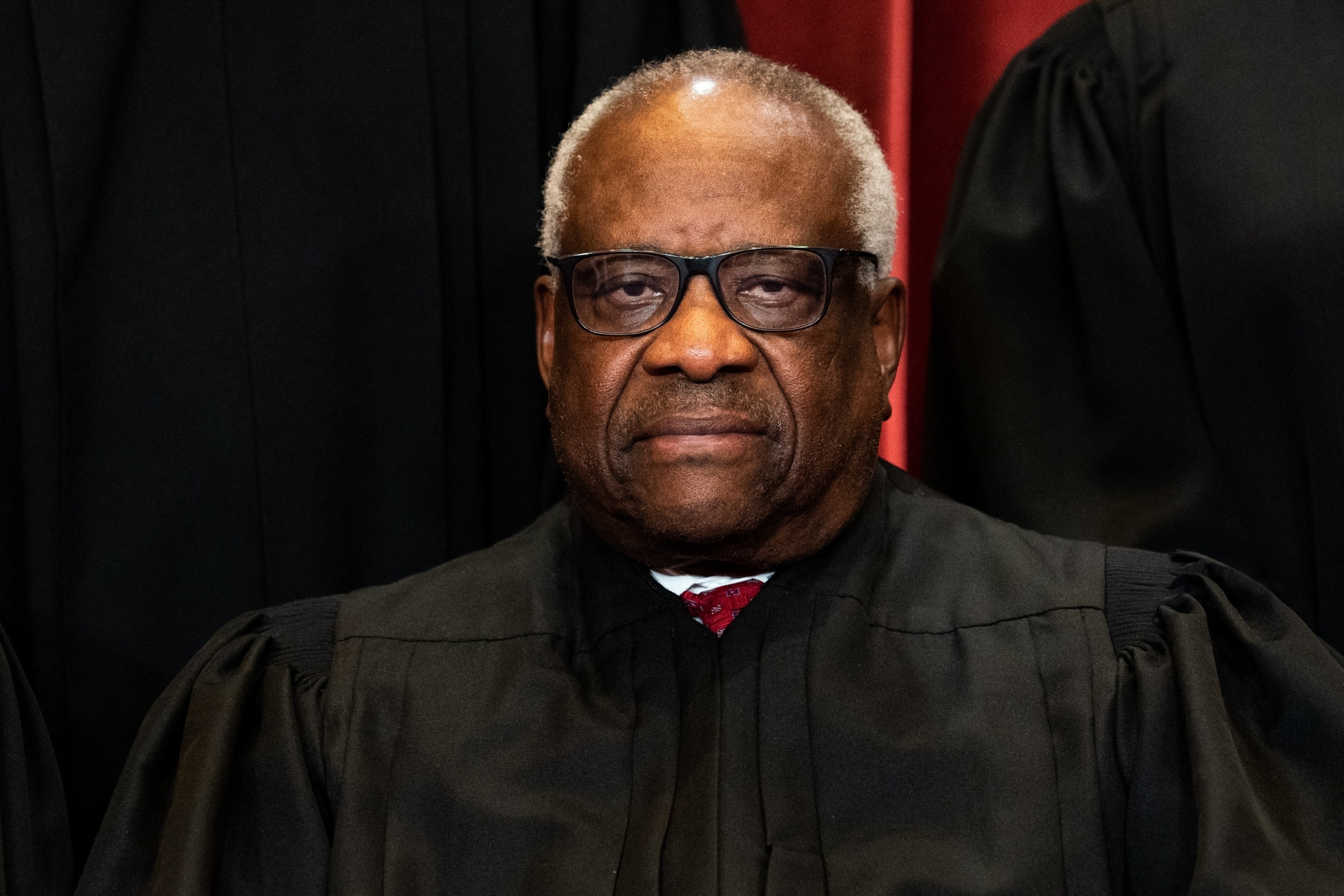 PHOTO: In this April 23, 2021 file photo, Associate Justice Clarence Thomas sits during a group photo of the Justices at the Supreme Court in Washington.