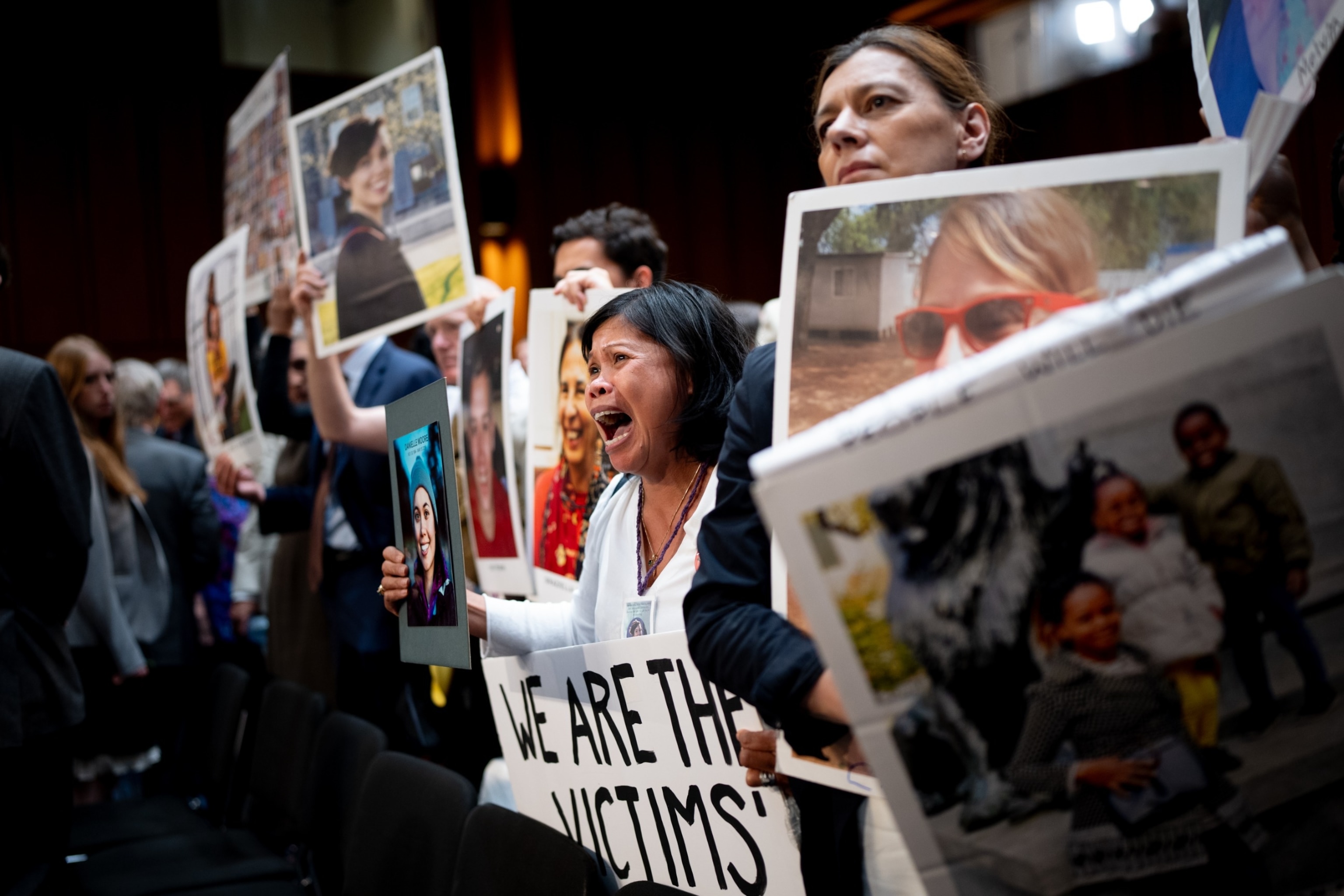 PHOTO: Clariss Moore of Toronto, Canada, holds a photograph of her daughter alongside other families of those killed on Ethiopian Airlines Flight 302 and Lion Air Flight 610 at a Senate subcommittee hearing on Boeing on June 18, 2024, in Washington, D.C.