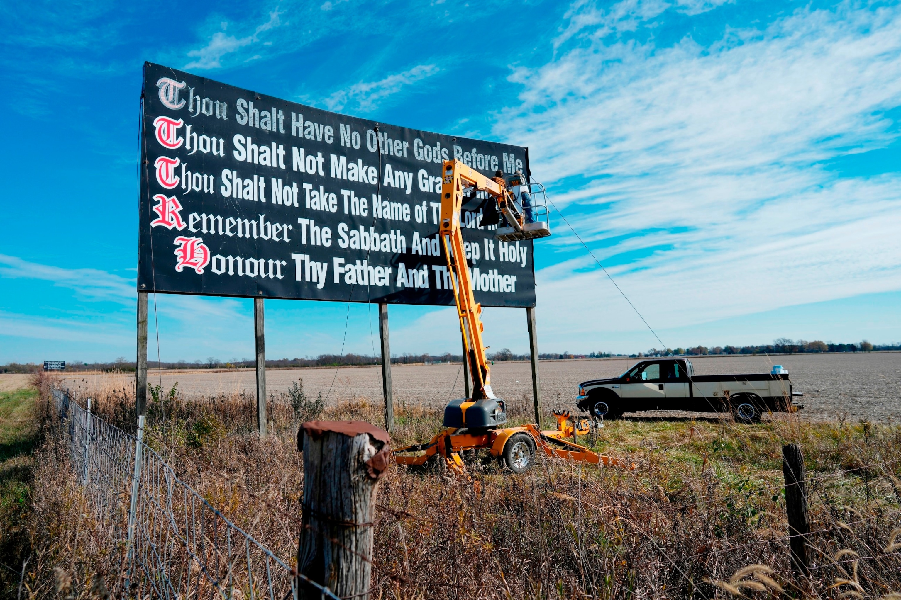 PHOTO: Workers repaint a Ten Commandments billboard off of Interstate 71 on Election Day near Chenoweth, Ohio, Nov. 7, 2023. 