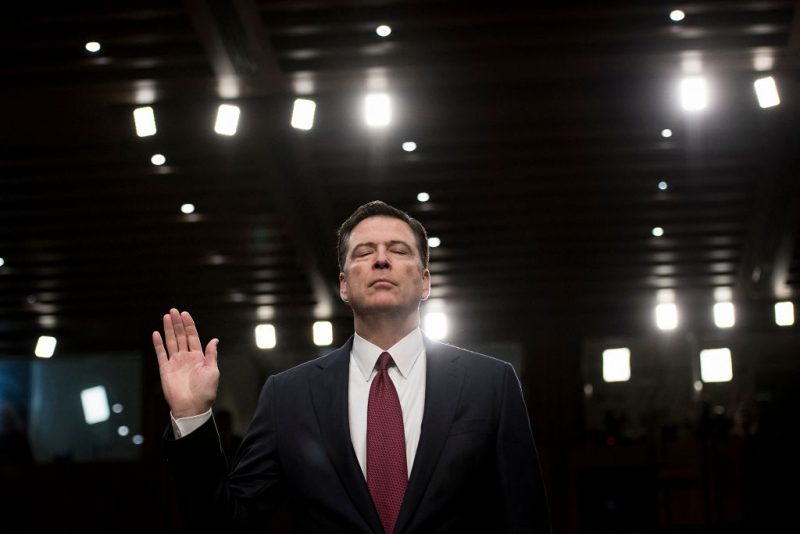 TOPSHOT - Ousted FBI director James Comey is sworn in during a hearing before the Senate Select Committee on Intelligence on Capitol Hill June 8, 2017 in Washington, DC. Fired FBI director James Comey took the stand Thursday in a crucial Senate hearing, repeating explosive allegations that President Donald Trump badgered him over the highly sensitive investigation Russia's meddling in the 2016 election. (Photo by Brendan Smialowski / AFP) (Photo by BRENDAN SMIALOWSKI/AFP via Getty Images)