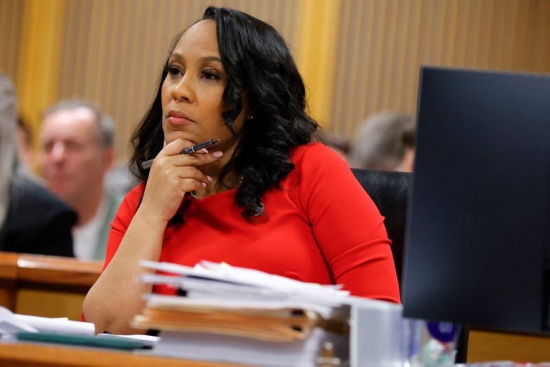 Fulton County District Attorney Fani Willis listens during the final arguments in her disqualification hearing at the Fulton County Courthouse on March 1, 2024, in Atlanta, Georgia. Fulton County Superior Judge Scott McAfee is considering a motion to disqualify Willis over her romantic relationship with Special Prosecutor Nathan Wade, whom she appointed as special prosecutor in the election interference charges against former president Donald Trump. (Photo by Alex Slitz / POOL / AFP) (Photo by ALEX SLITZ/POOL/AFP via Getty Images)