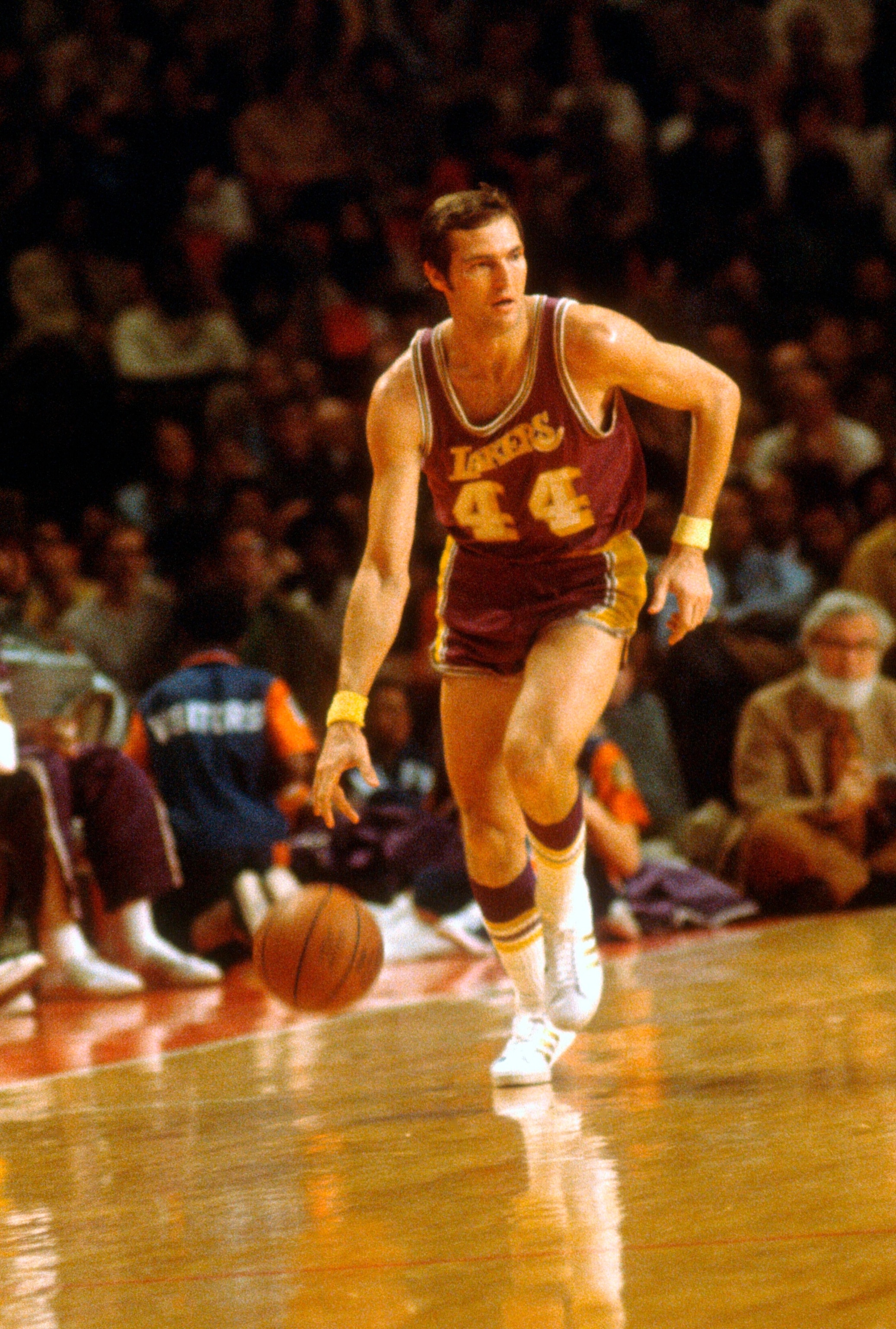 PHOTO: Jerry West #44 of the Los Angeles Lakers dribbles the ball up court