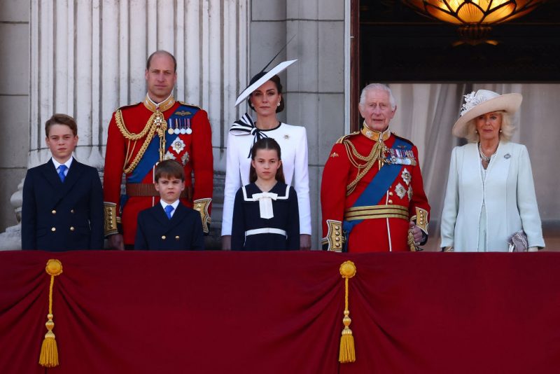 TOPSHOT - (L-R) Britain's Prince George of Wales, Britain's Prince William, Prince of Wales, Britain's Prince Louis of Wales, Britain's Catherine, Princess of Wales, Britain's Princess Charlotte of Wales, Britain's King Charles III and Britain's Queen Camilla stand on the balcony of Buckingham Palace after attending the King's Birthday Parade "Trooping the Colour" in London on June 15, 2024. The ceremony of Trooping the Colour is believed to have first been performed during the reign of King Charles II. Since 1748, the Trooping of the Colour has marked the official birthday of the British Sovereign. Over 1500 parading soldiers and almost 300 horses take part in the event. (Photo by HENRY NICHOLLS / AFP) (Photo by HENRY NICHOLLS/AFP via Getty Images)