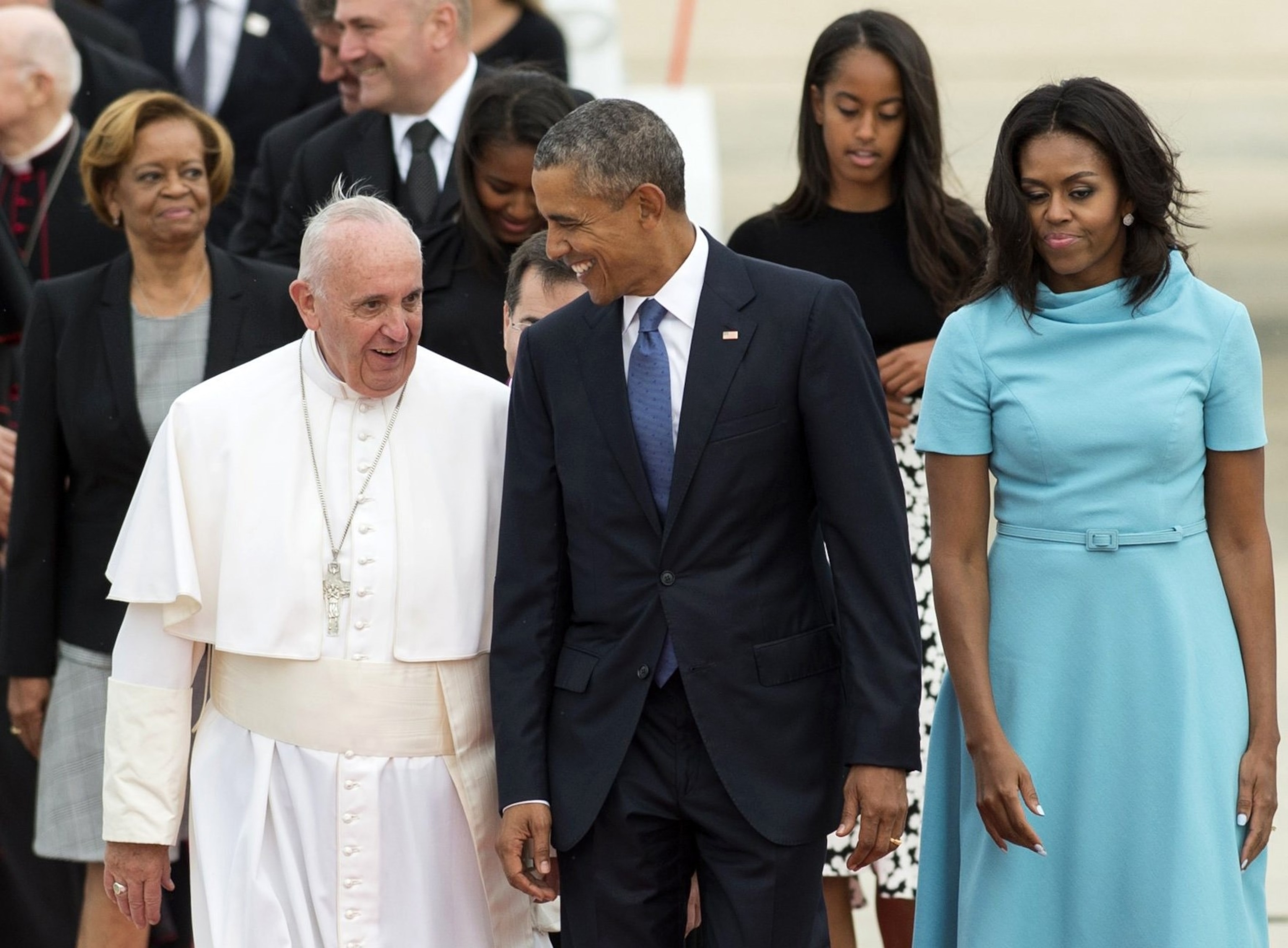 PHOTO: Pope Francis walks alongside President Barack Obama and First Lady Michelle Obama upon arrival at Andrews Air Force Base in Maryland, on Sept. 22, 2015.