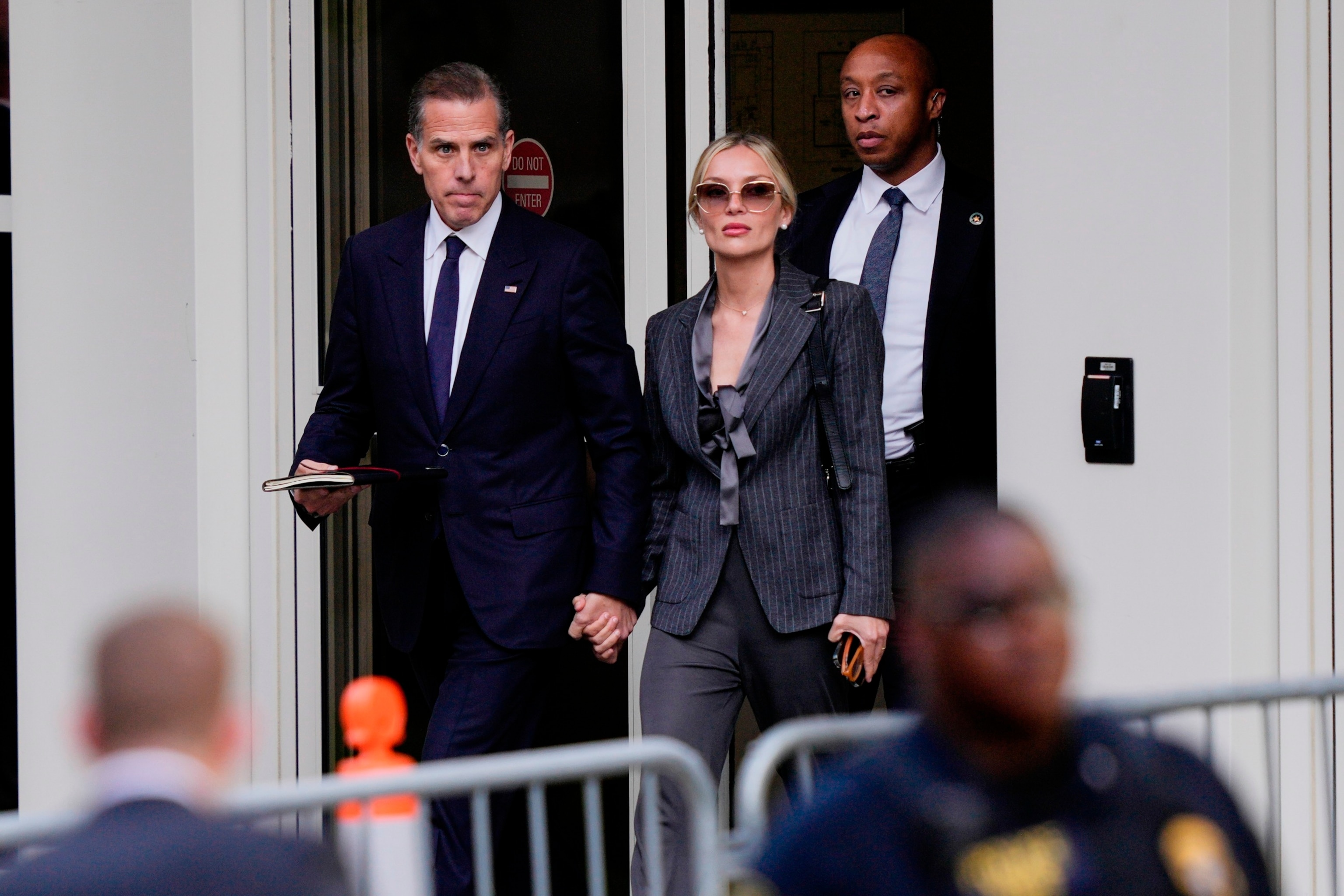 PHOTO: Hunter Biden, left, accompanied by his wife, Melissa Cohen Biden, depart from federal court, June 3, 2024, in Wilmington, Del. 