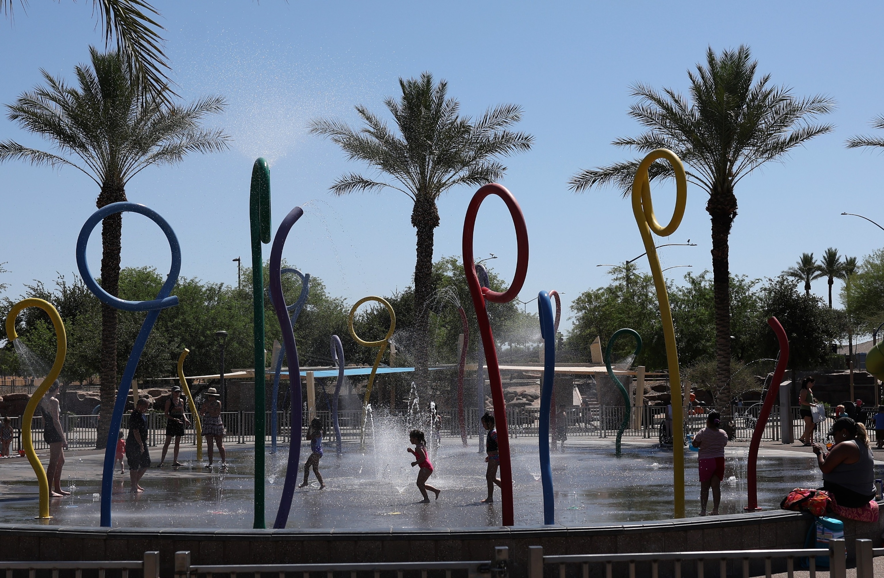 PHOTO: Kids play in a splash pad at Riverview Park on June 05, 2024 in Mesa, Ariz.