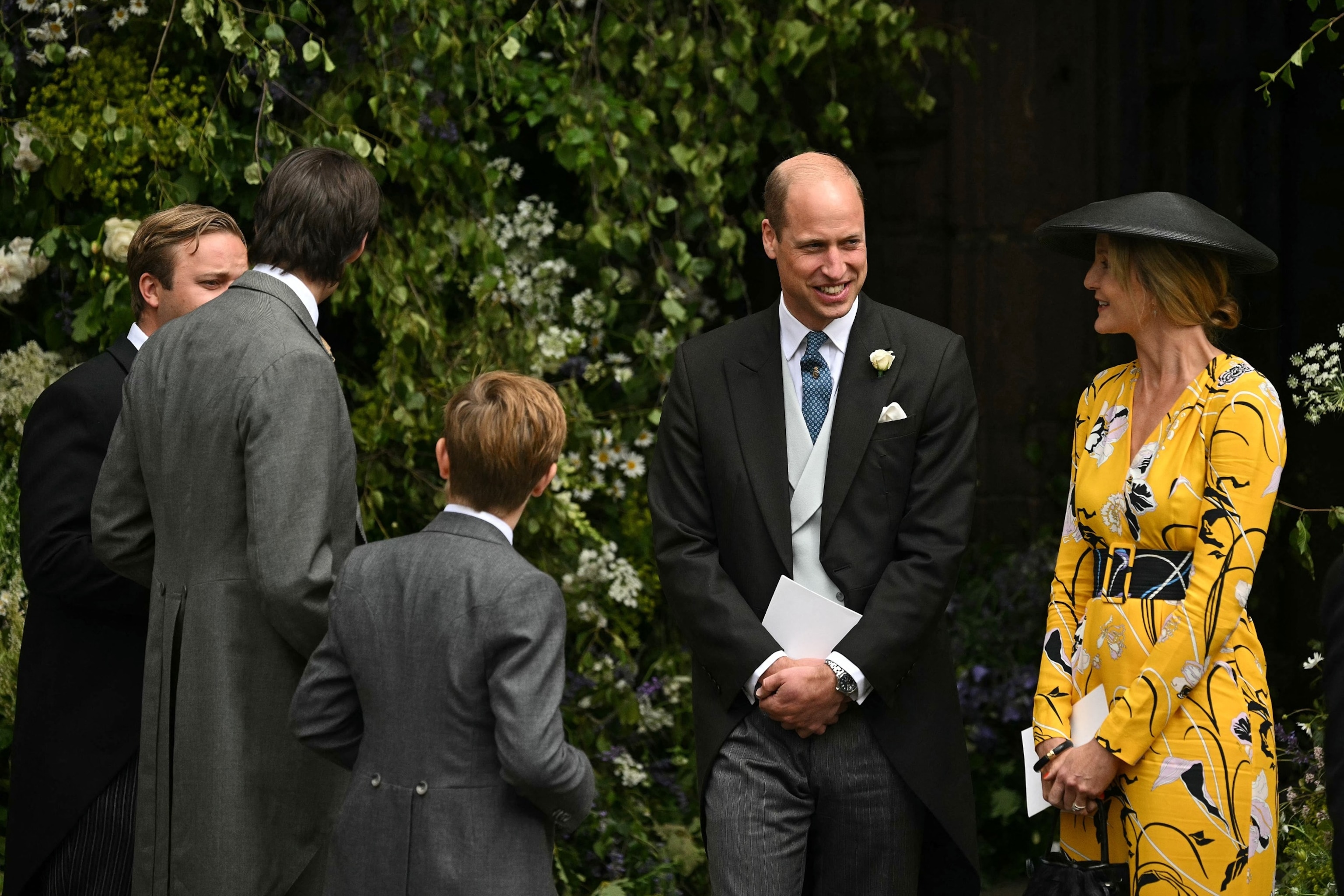 PHOTO: Britain's Prince William, Prince of Wales (2R) mingles with guests after attending the wedding service of Hugh Grosvenor, Duke of Westminster and Olivia Henson, at Chester Cathedral in Chester, northern England on June 7, 2024.